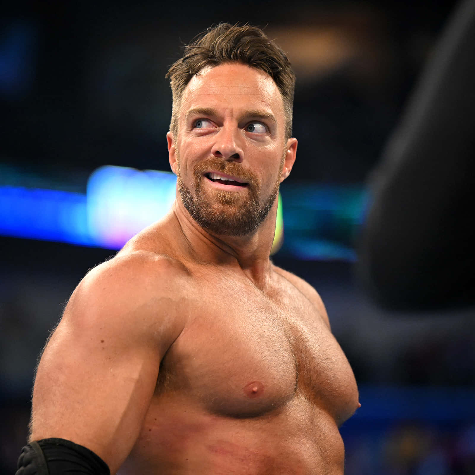 La Knight In Action With A Confident Smirk At Wwe Event. Background