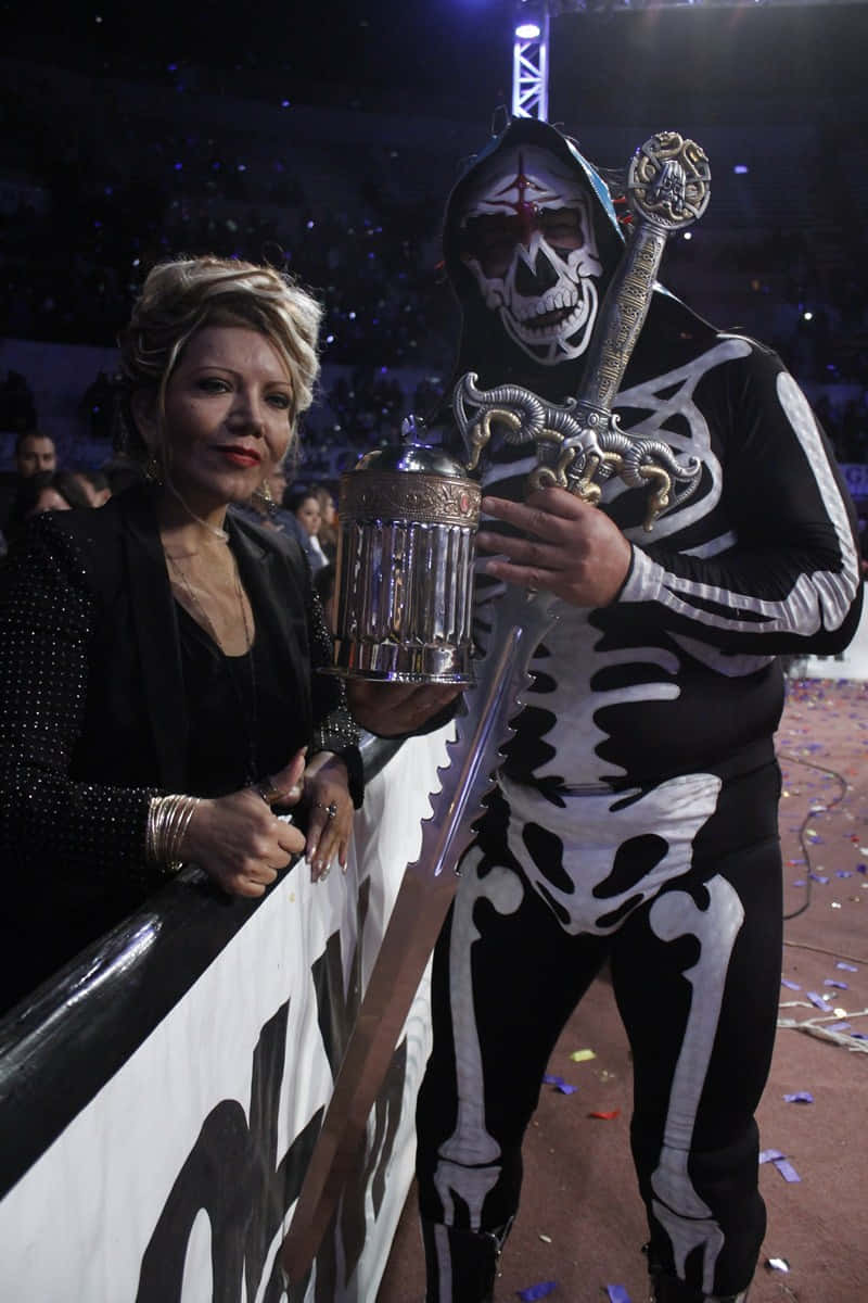 La Parka Wrestlerwith Championship Beltand Fan Background