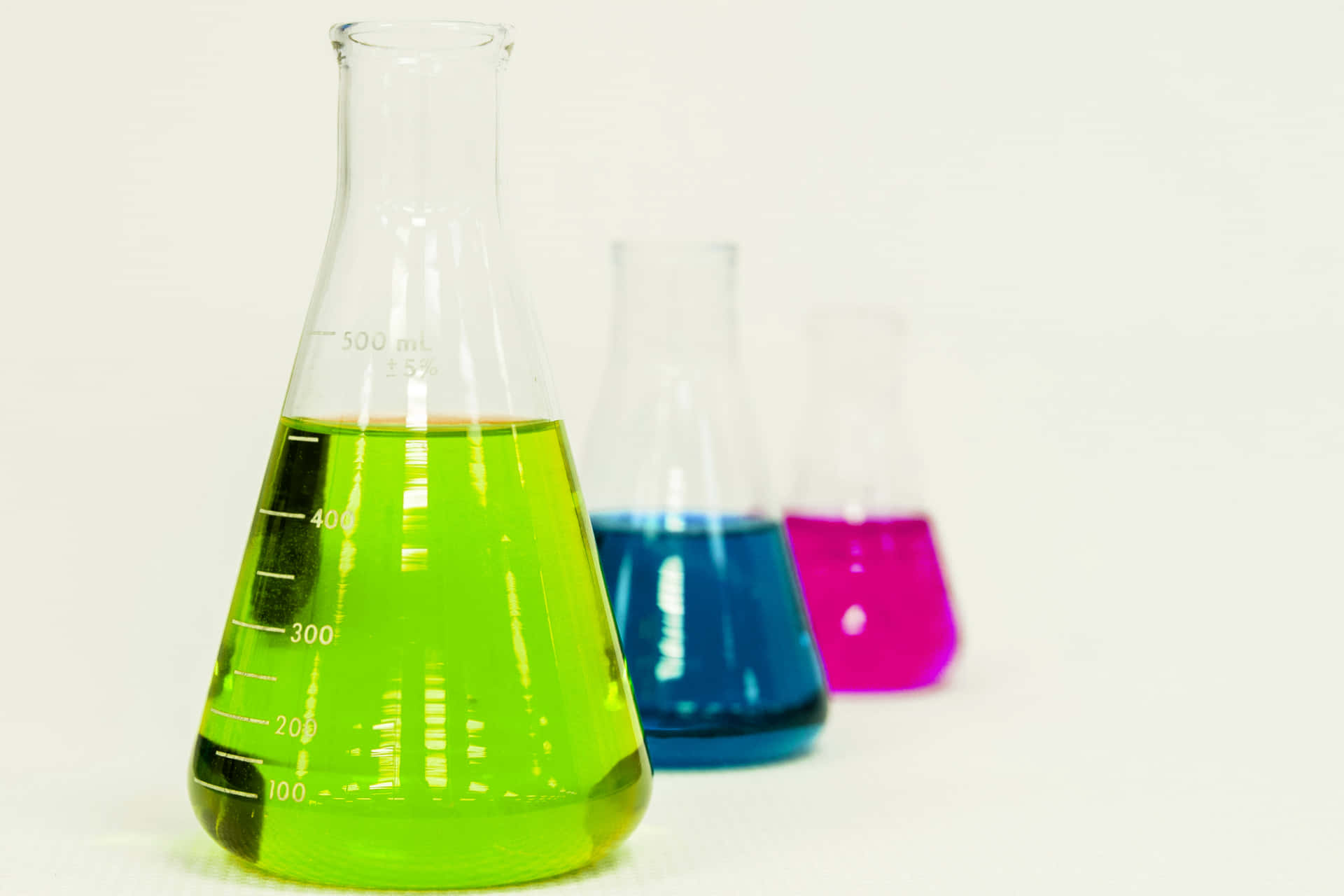 Laboratory Flasks With Colorful Liquids Background