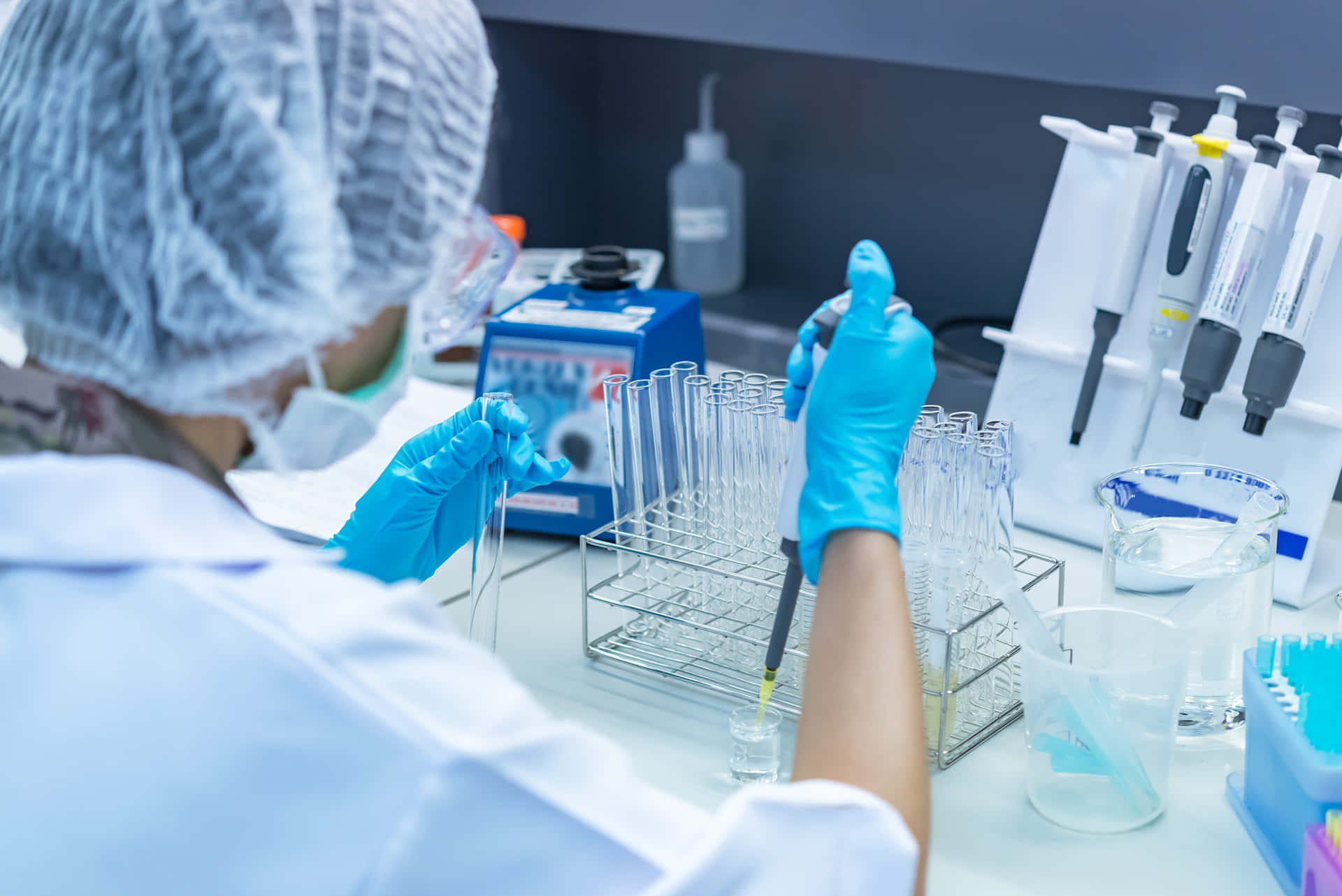 Laboratory Scientist Extracting Liquid Background