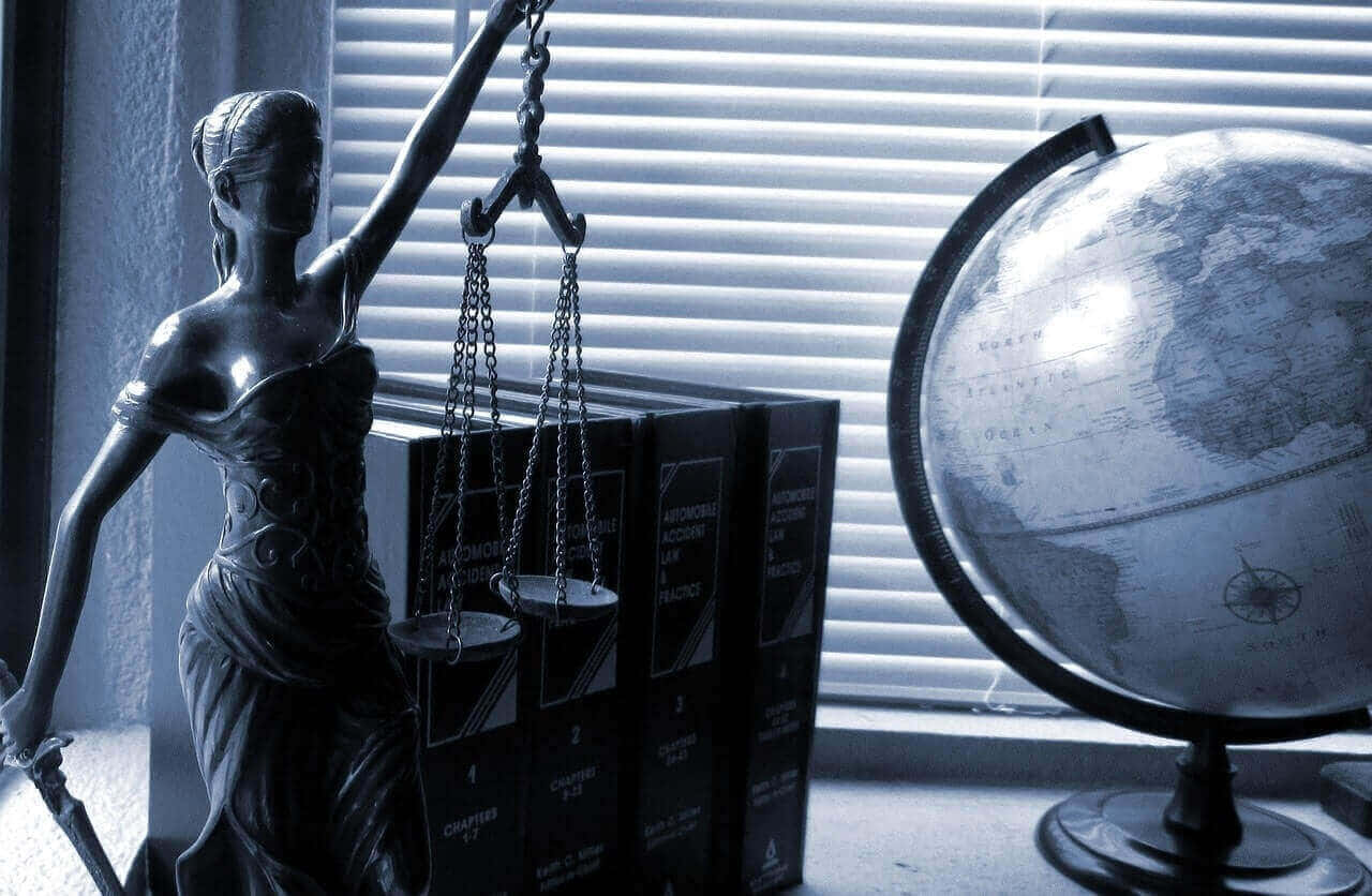 Lady Justice Statue On Punitive Laws Background