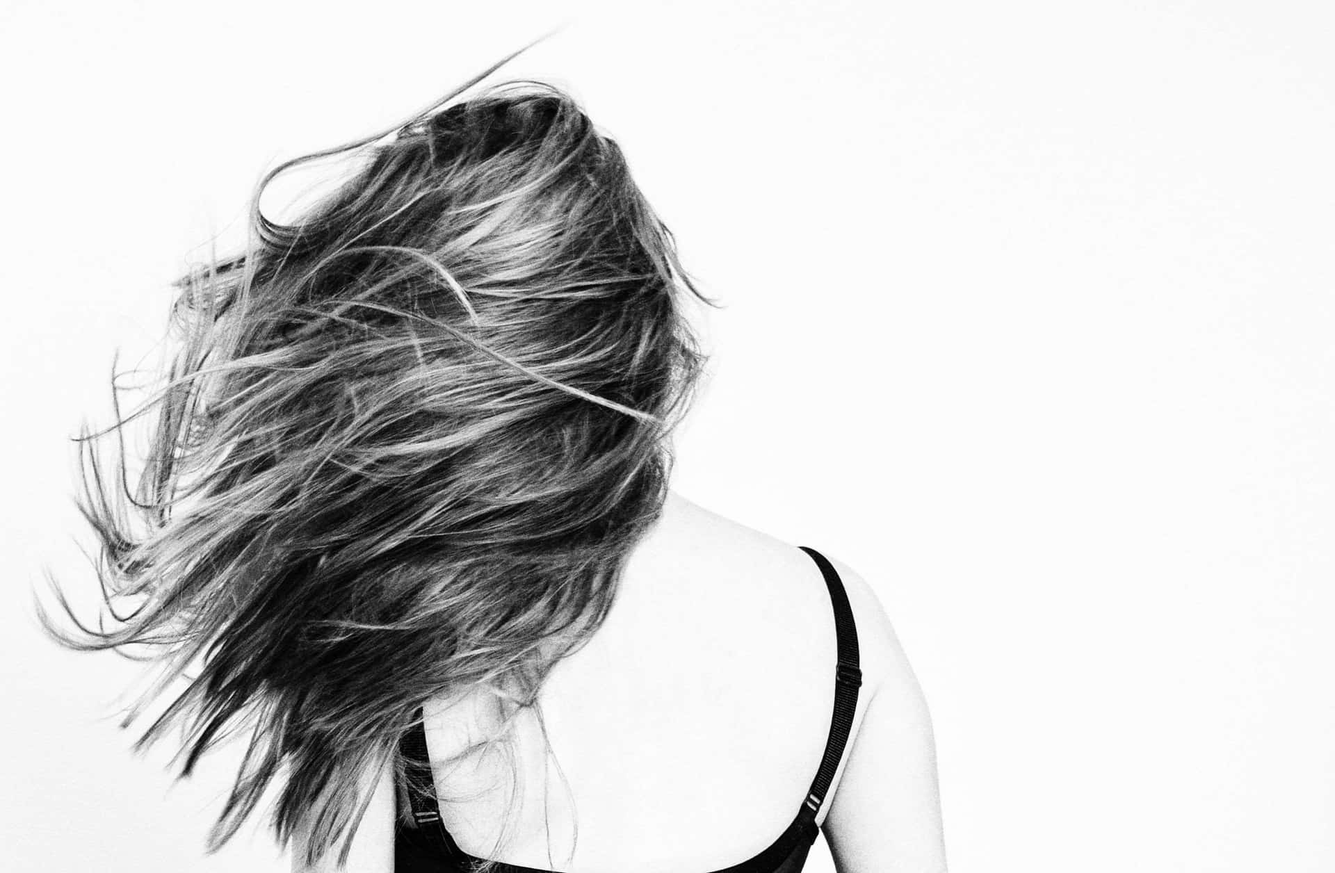 Lady's Exceptional Windblown Hair Background