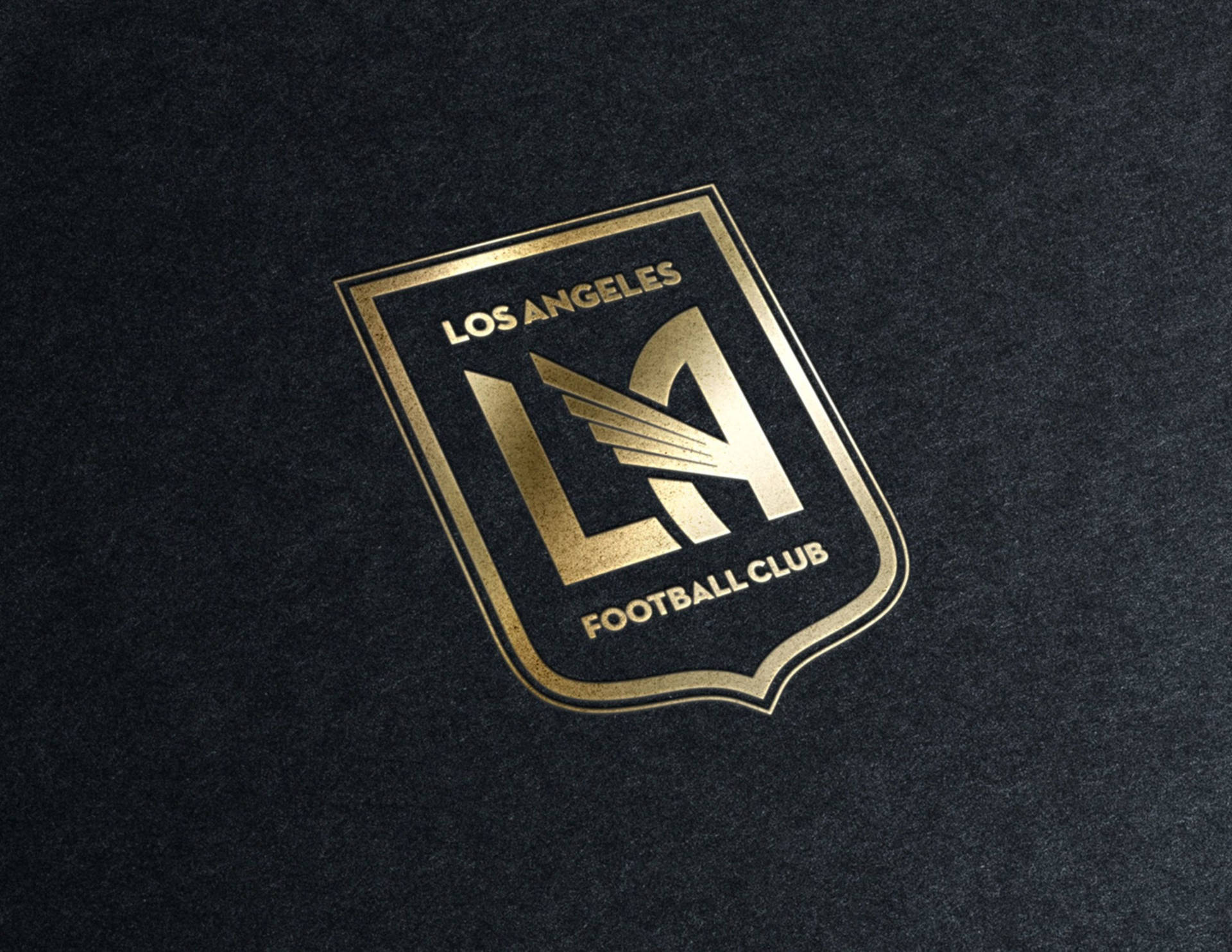 Lafc Gold Logo Embedded On Black Backdrop Background
