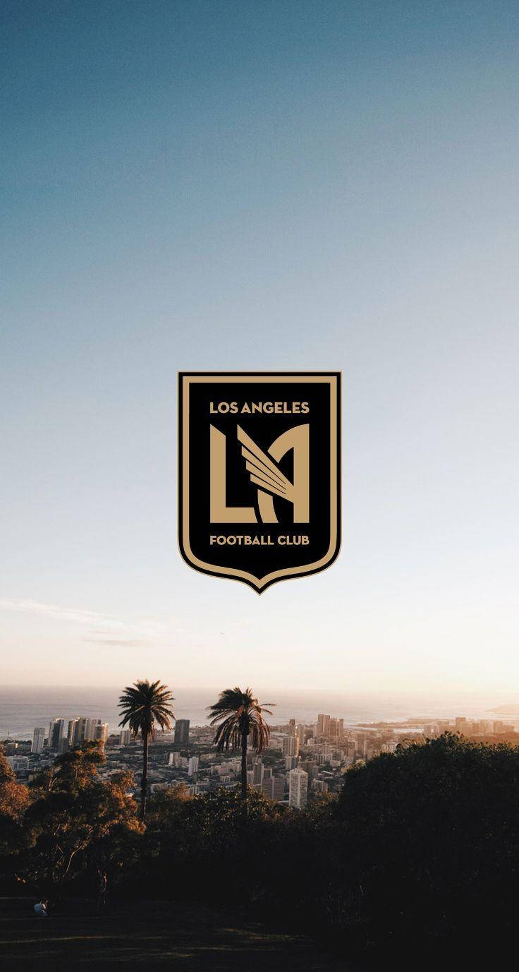 Lafc Logo With Backdrop Of The City Background