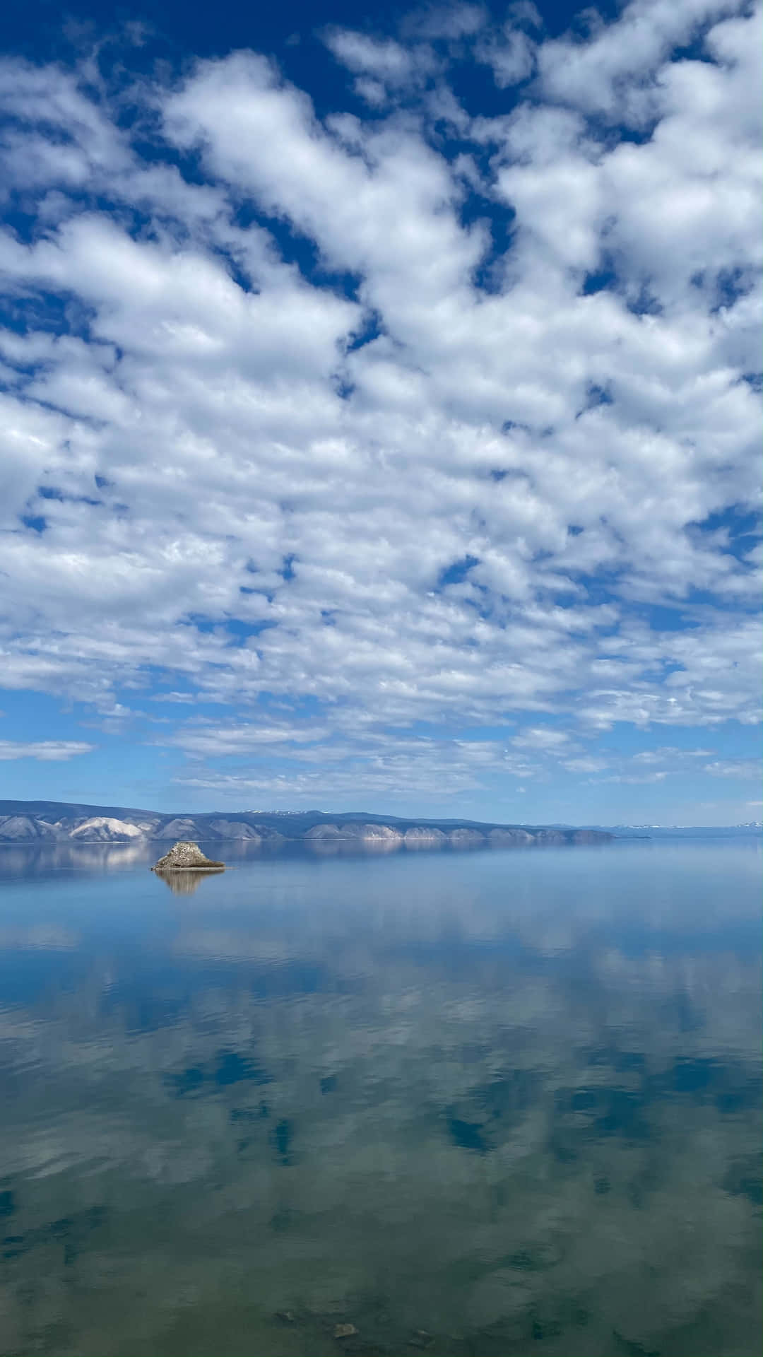 Lake Baikal Clear View Reflecting The Sky Background