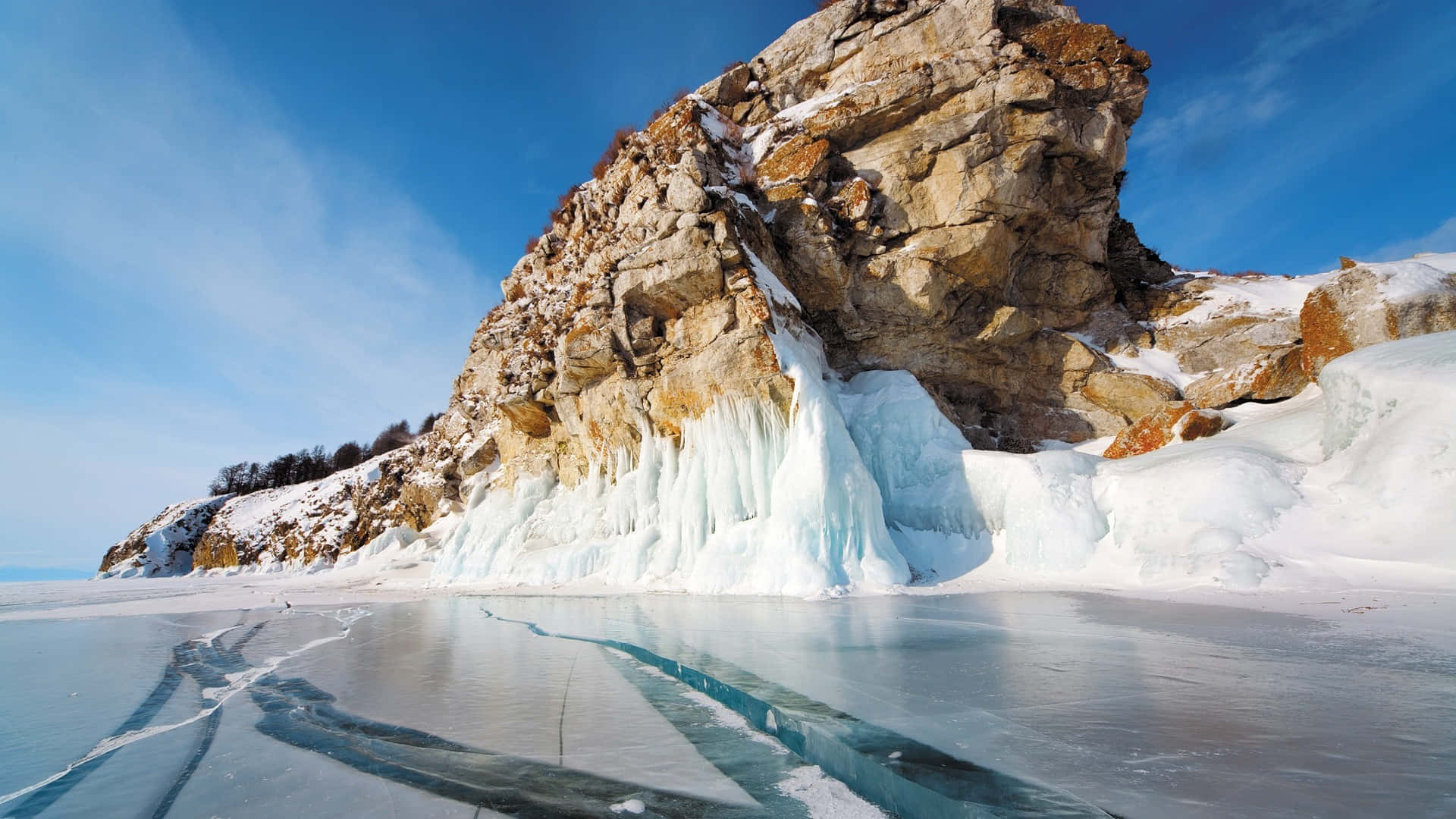Lake Baikal Snowy Ice Beside The Rock Background