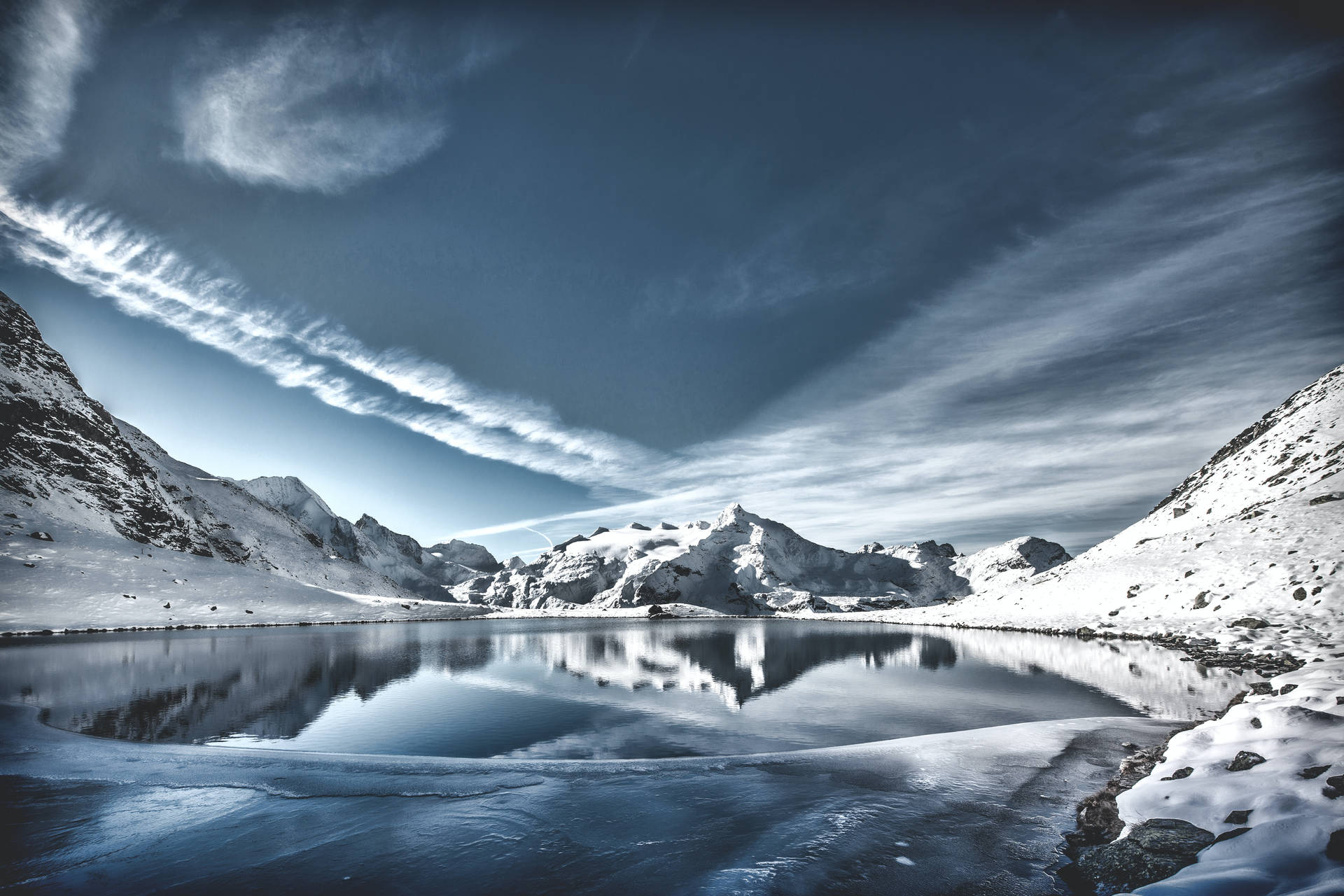Lake Reflects Mountain In Cool Winter Background