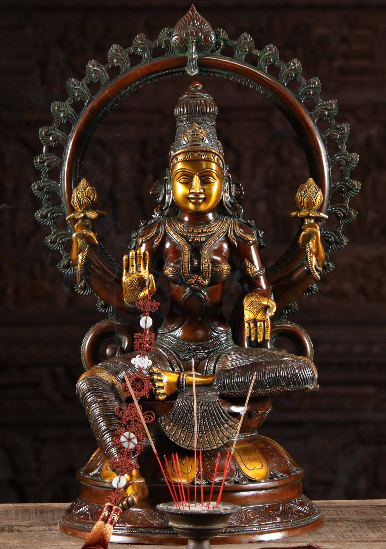 Lakshmi Devi Brass Figurine With Incense Background