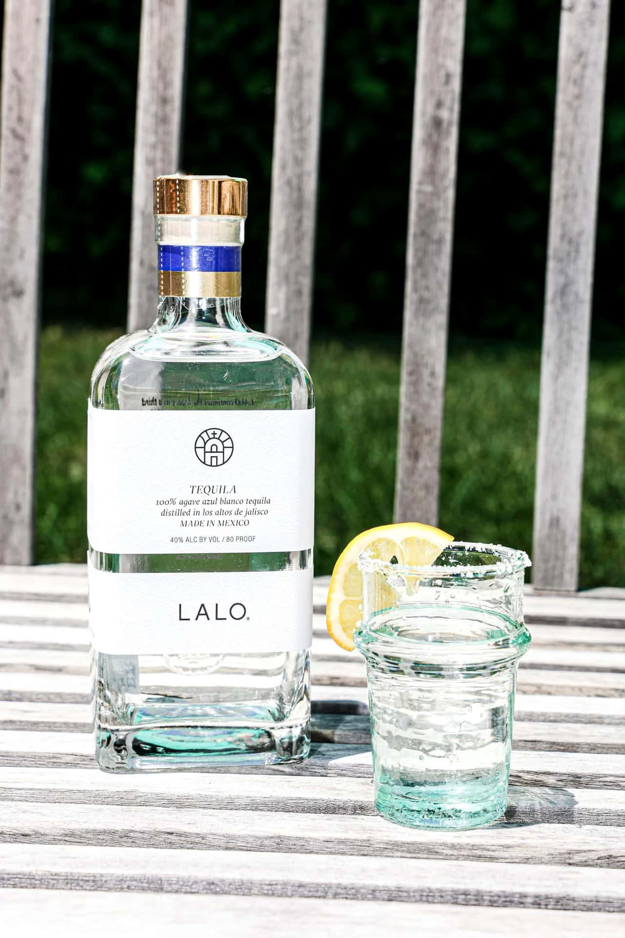 Lalo Tequila Bottleand Glass Outdoor Setting Background