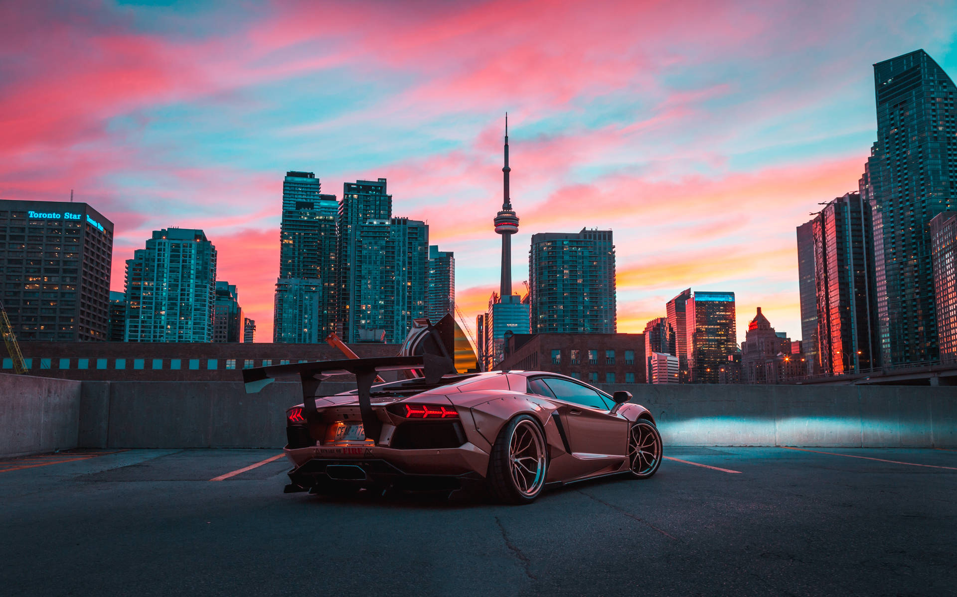 Lamborghini And Cn Tower In Toronto Background