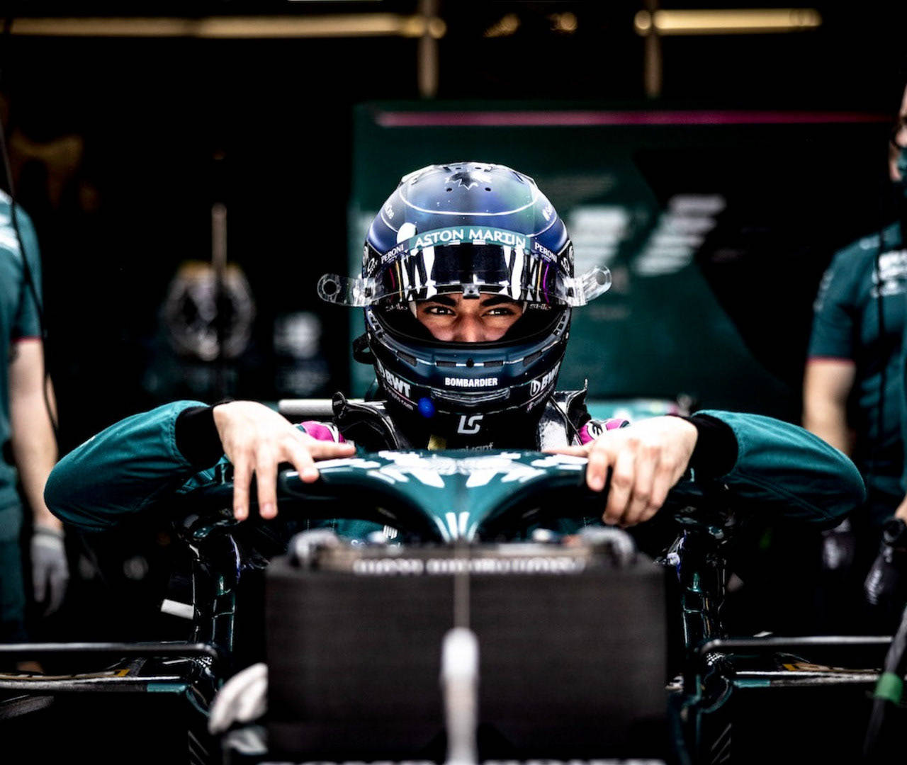 Lance Stroll Holding The Halo Background