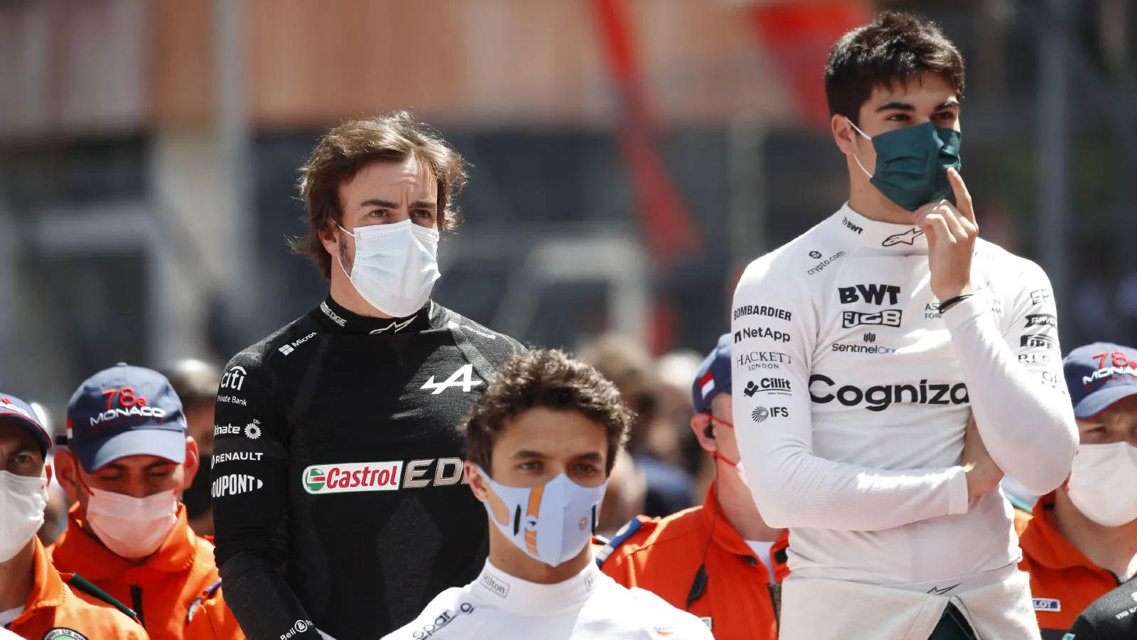 Lance Stroll With Alonso And Norris Background