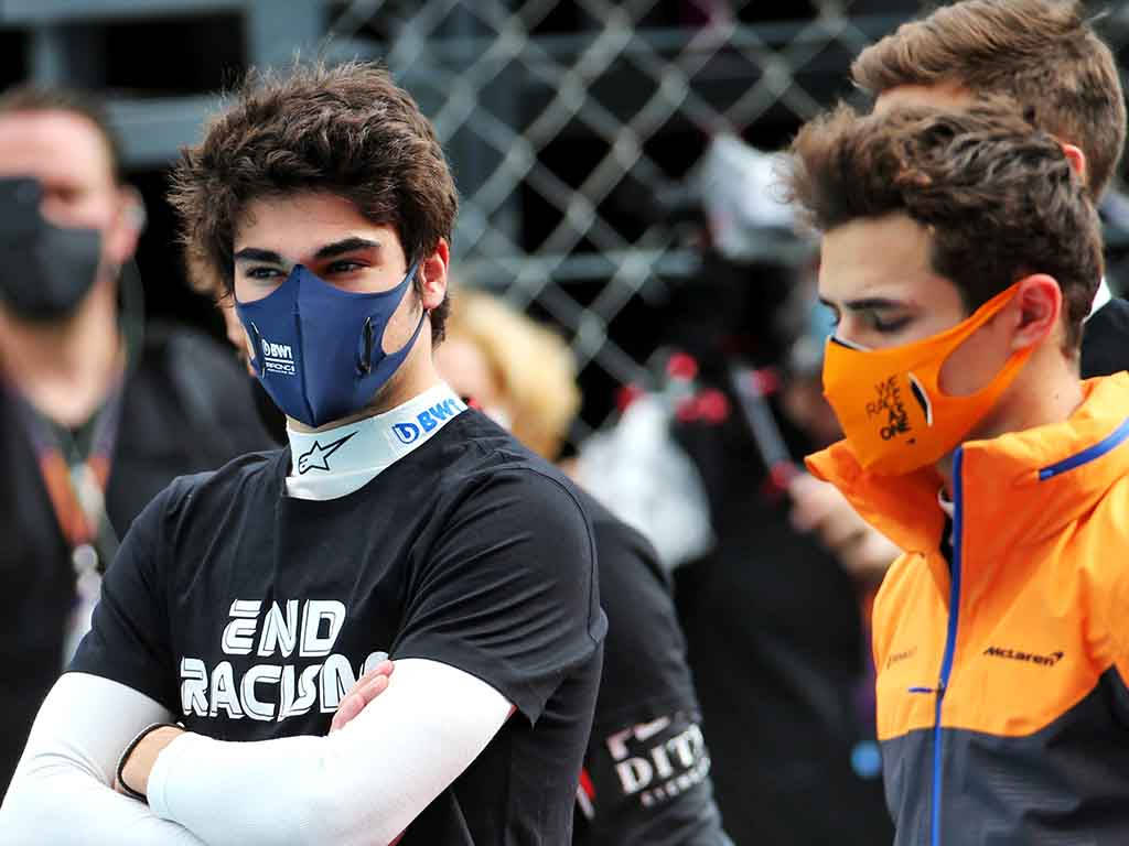 Lance Stroll With Lando Norris Background