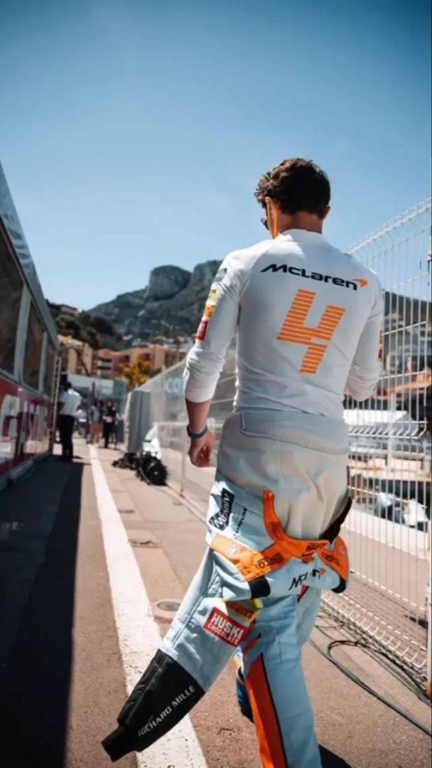 Lando Norris White Racing Suit Background