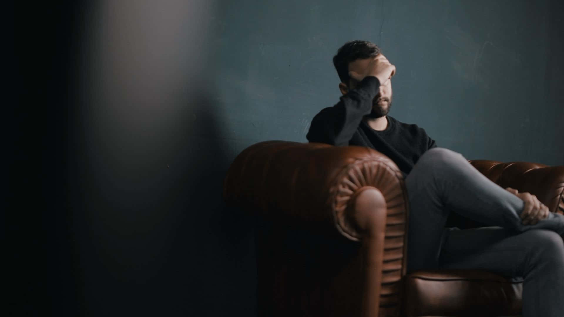 Languishing Man On The Couch Background