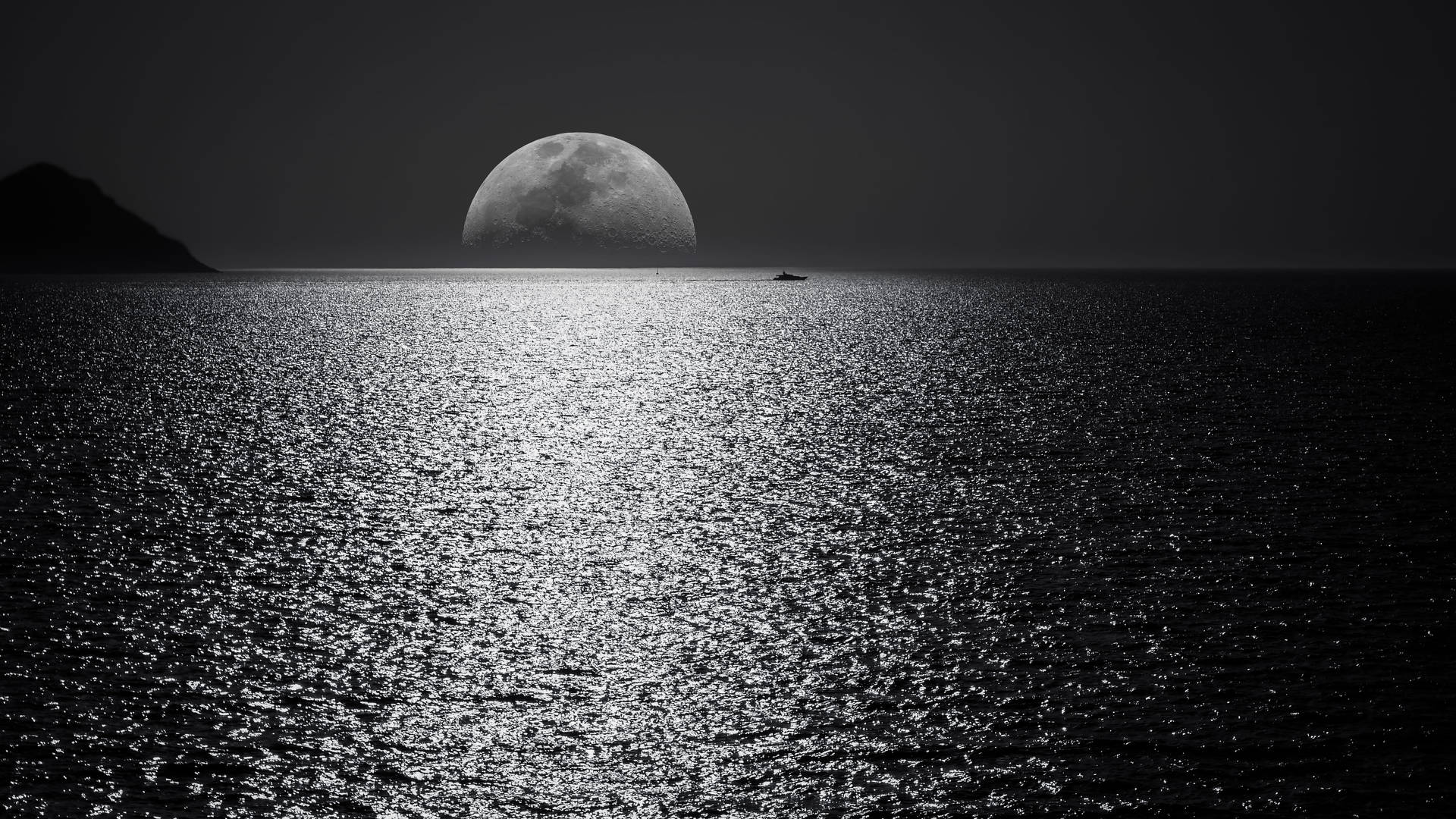 Laptop With A Breathtaking Nocturnal Sea View And Moon On Display Background