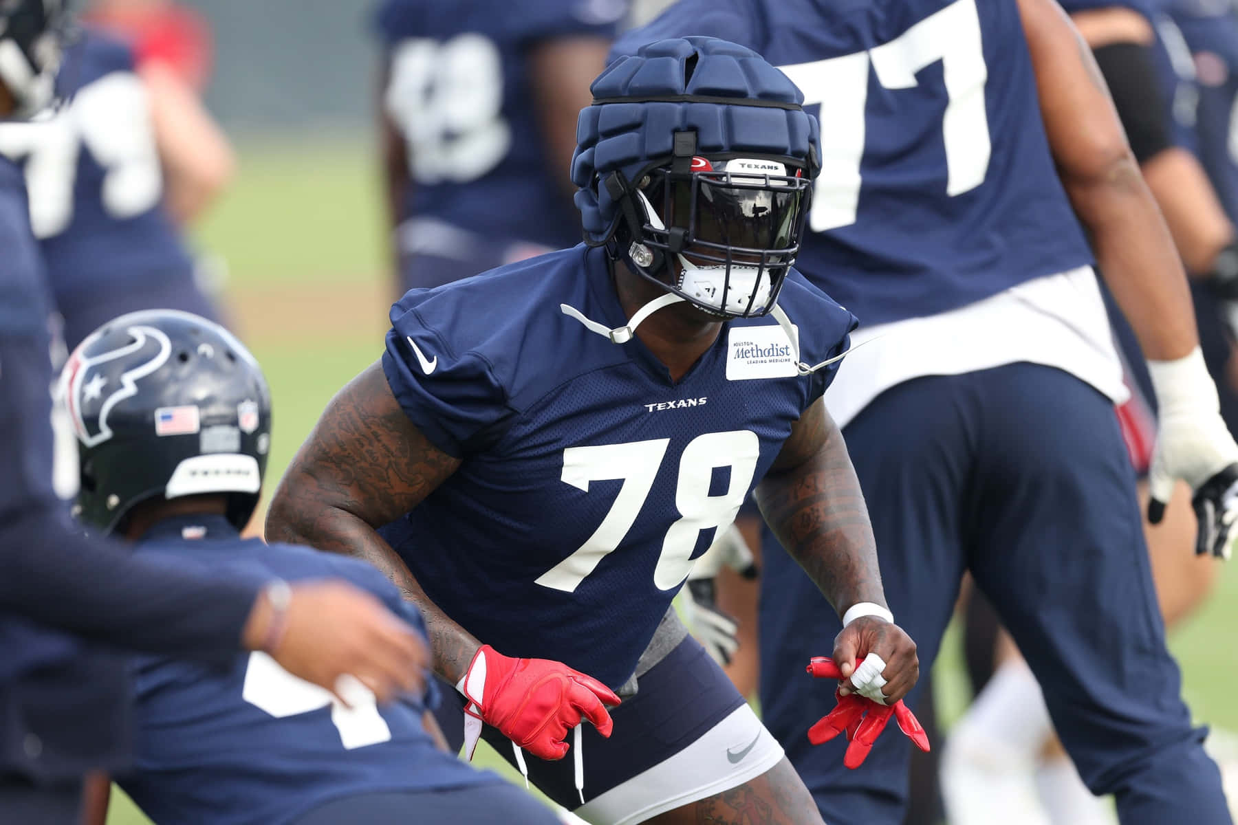 Laremy Tunsil In Action Wearing A Dark Blue Football Kit Background