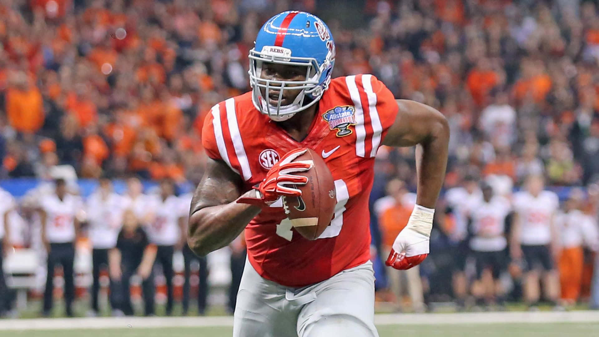 Laremy Tunsil Running With The Football Background