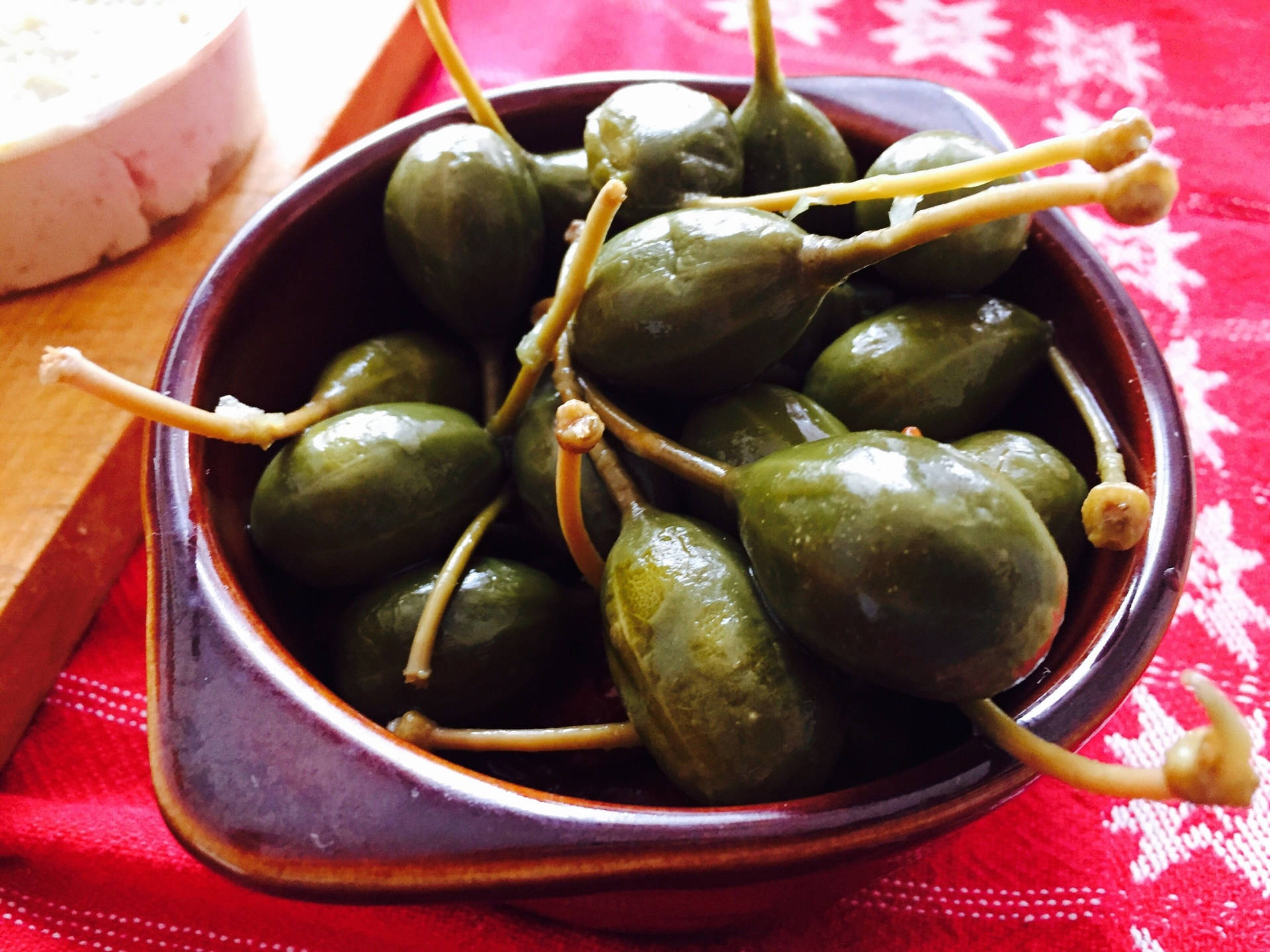 Large Capers With Stems In Bowl Background