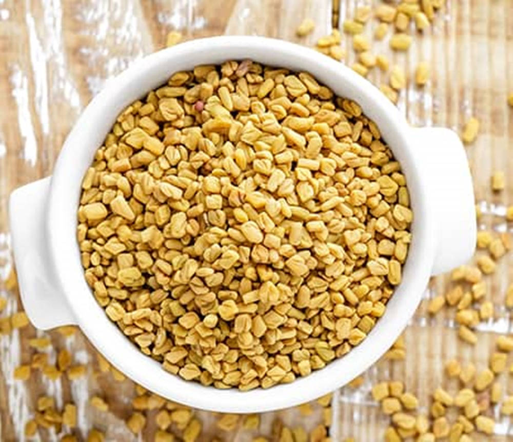 Large Ceramic Pan Filled With Fenugreek Seeds