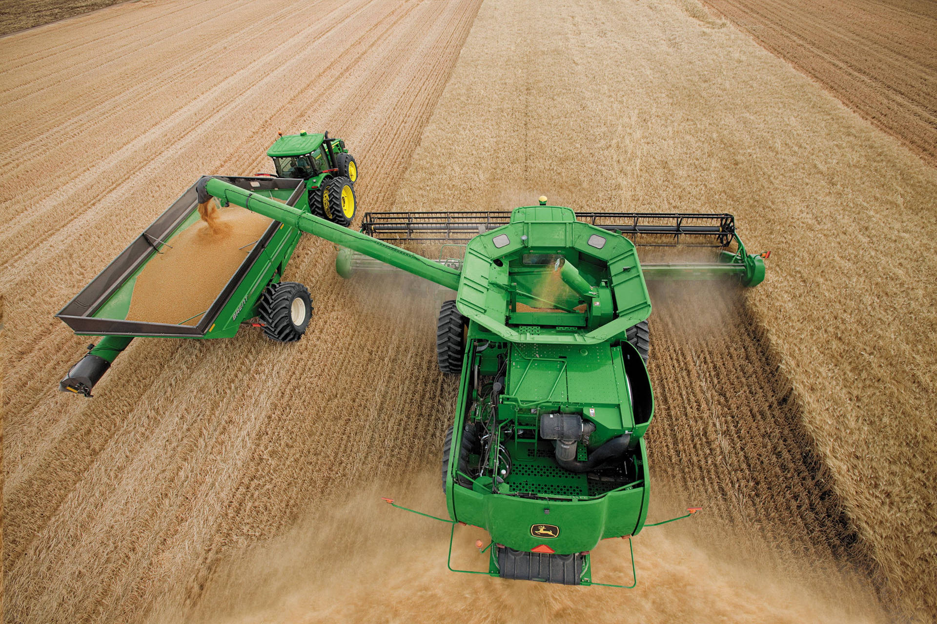 Large John Deere Machine Harvesting Wheat Background