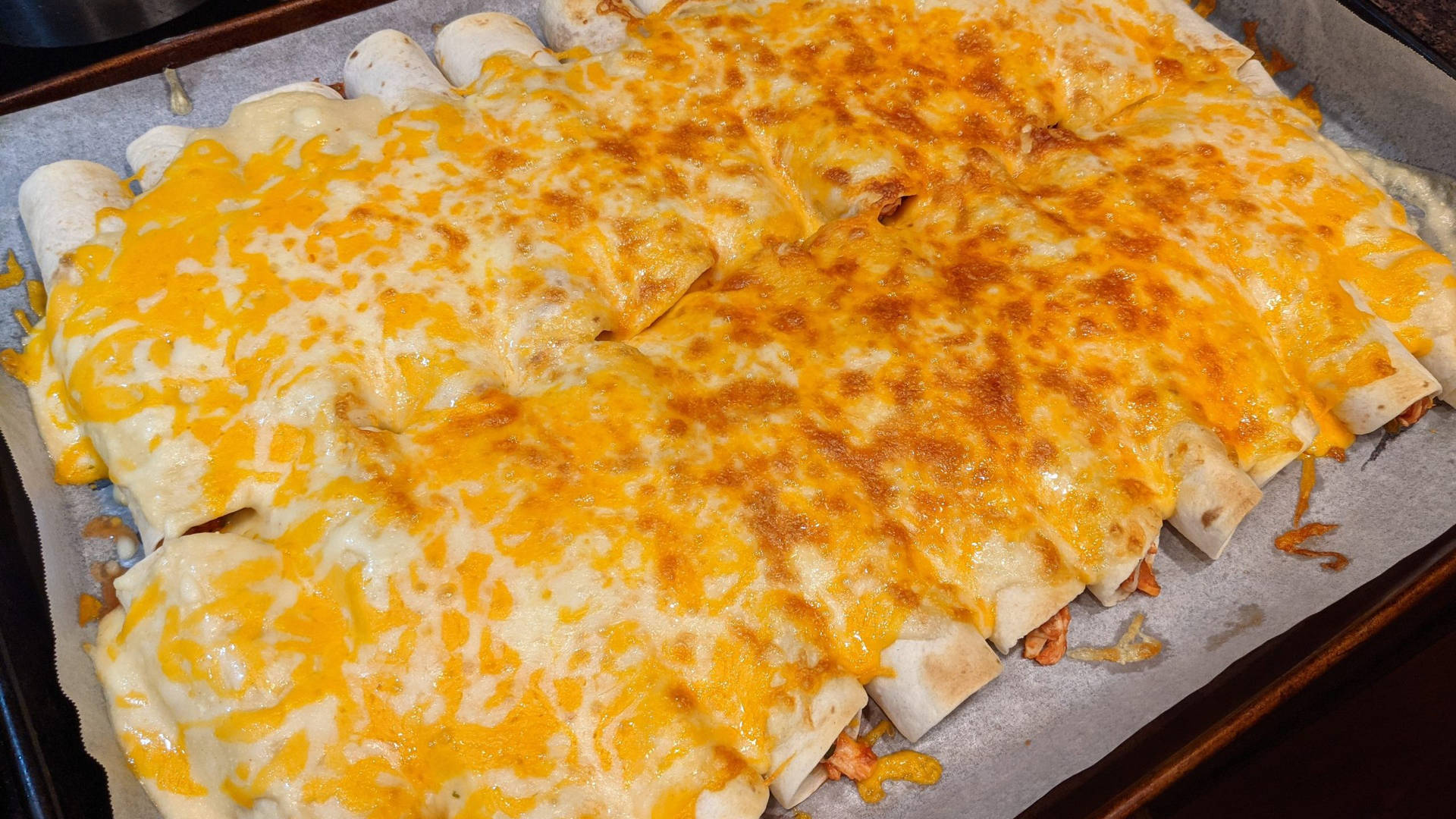 Large Tray Of Cheesy Enchiladas Background