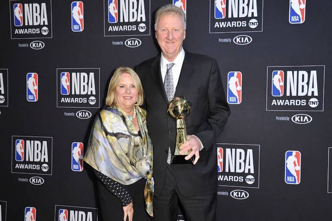Larry Bird And Dinah Mattingly At A Formal Event Background