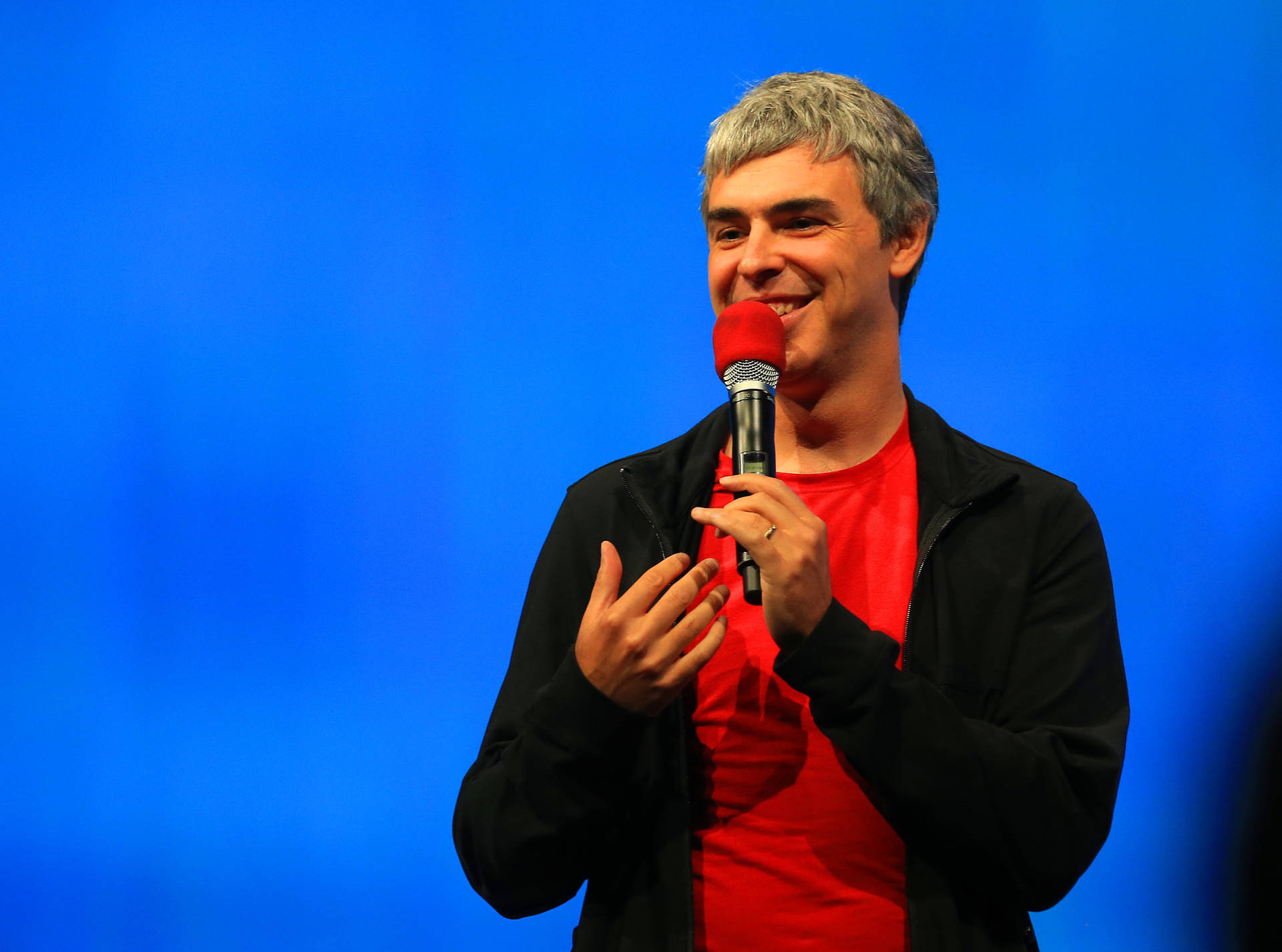 Larry Page Conference Talk Smiling Photo Background