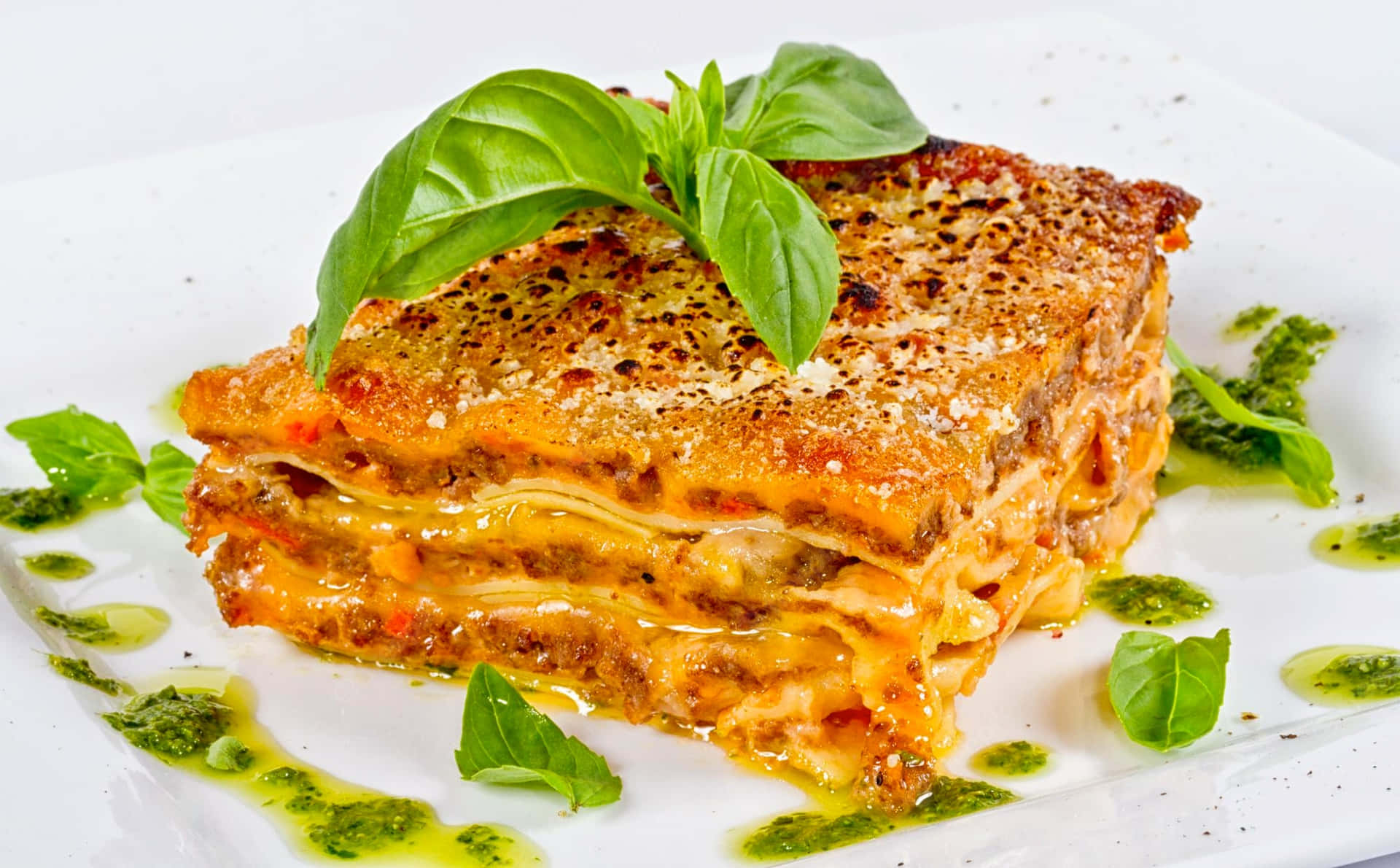 Lasagna Alla Bolognese Garnished With Basil Background