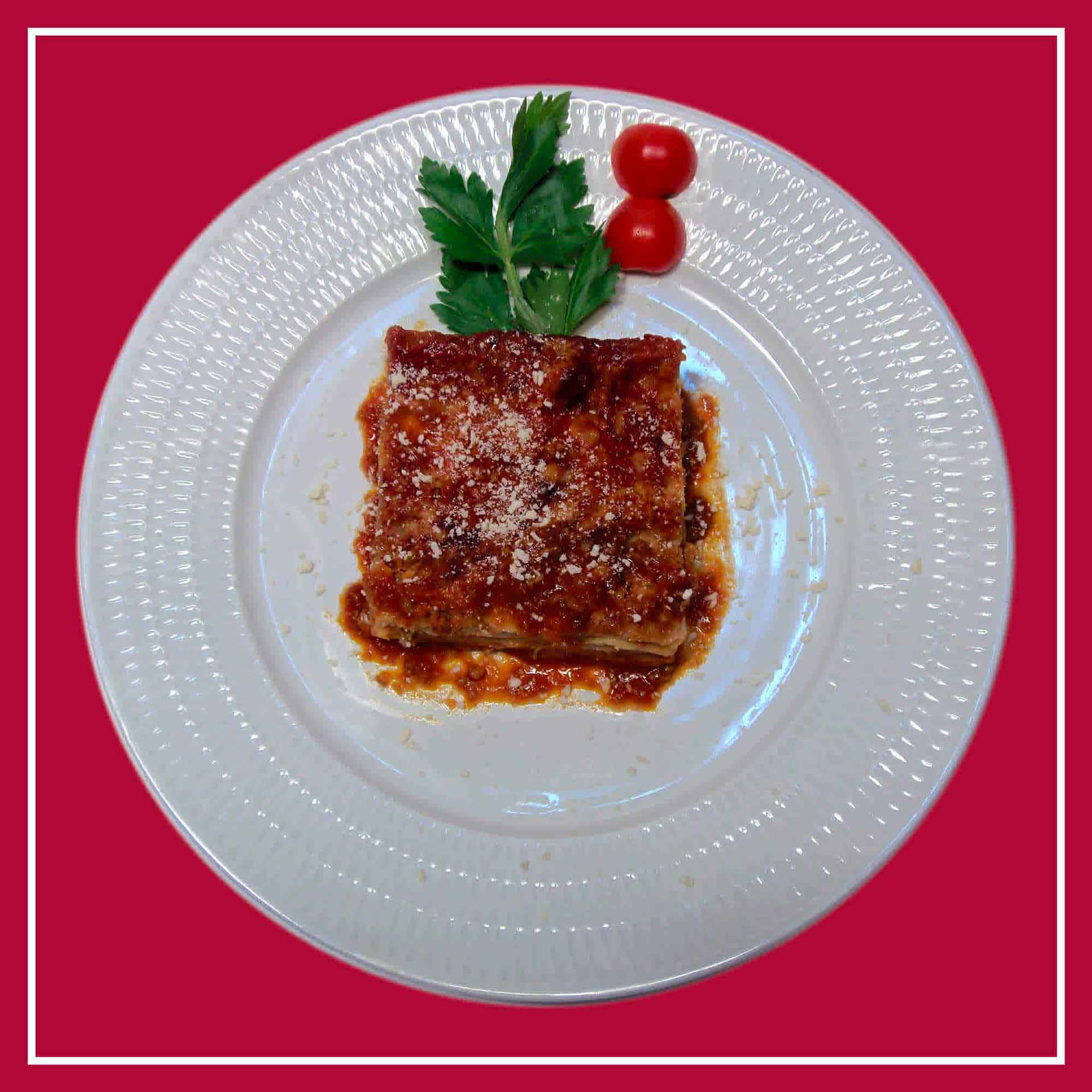 Lasagna Alla Bolognese With Red Sauce Background