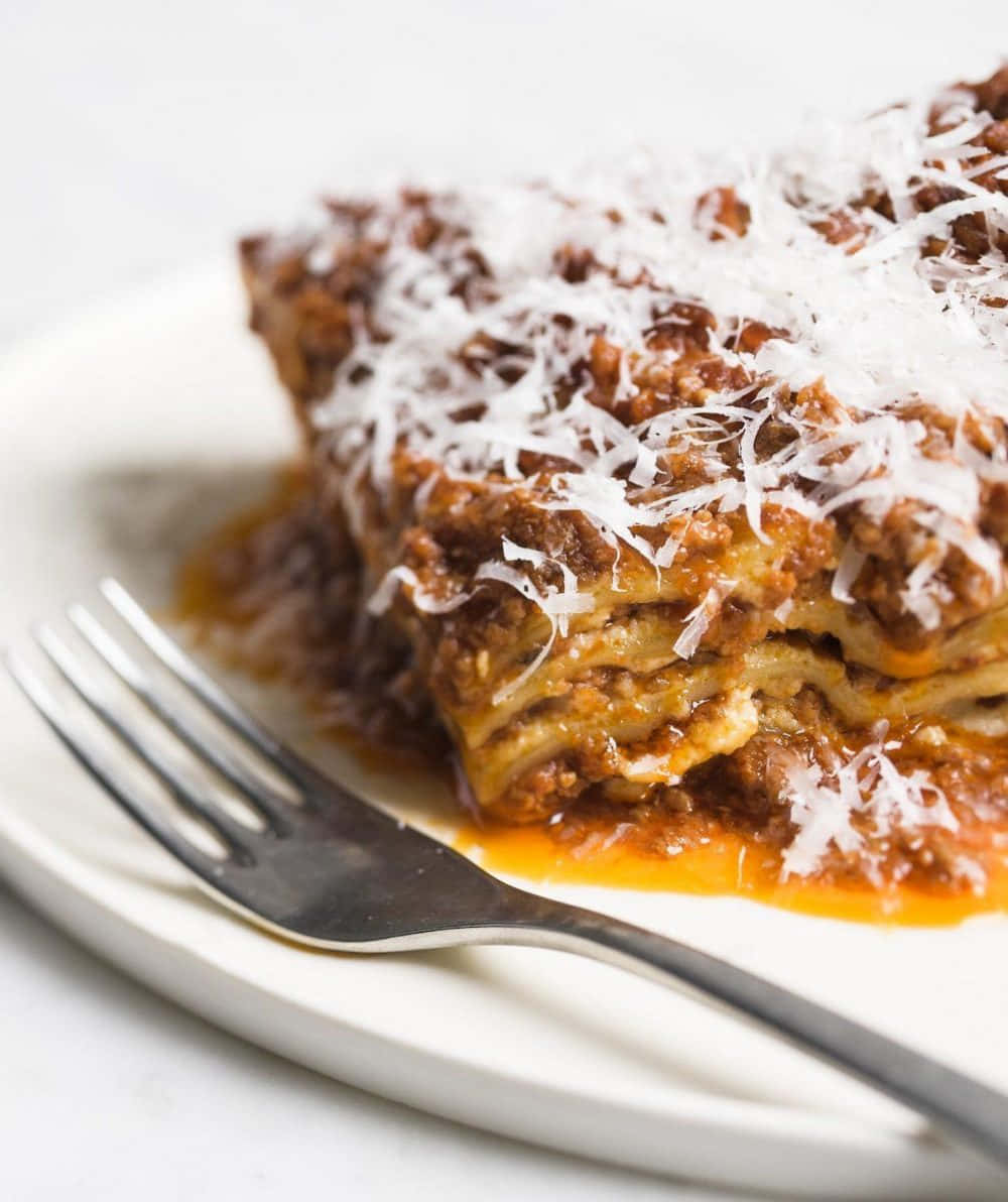 Lasagna Alla Bolognese With White Parmesan Background