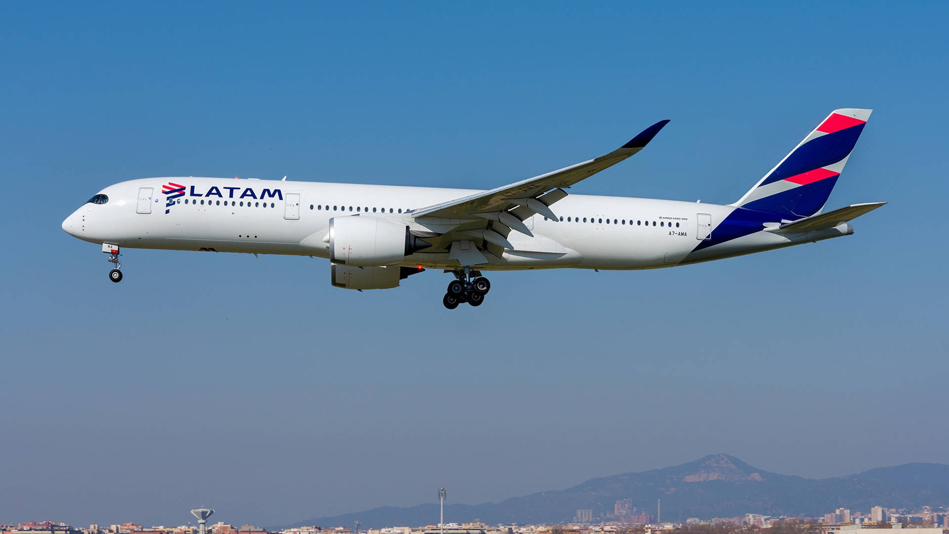 Latam Airplane Flying Over Blue Sky Background