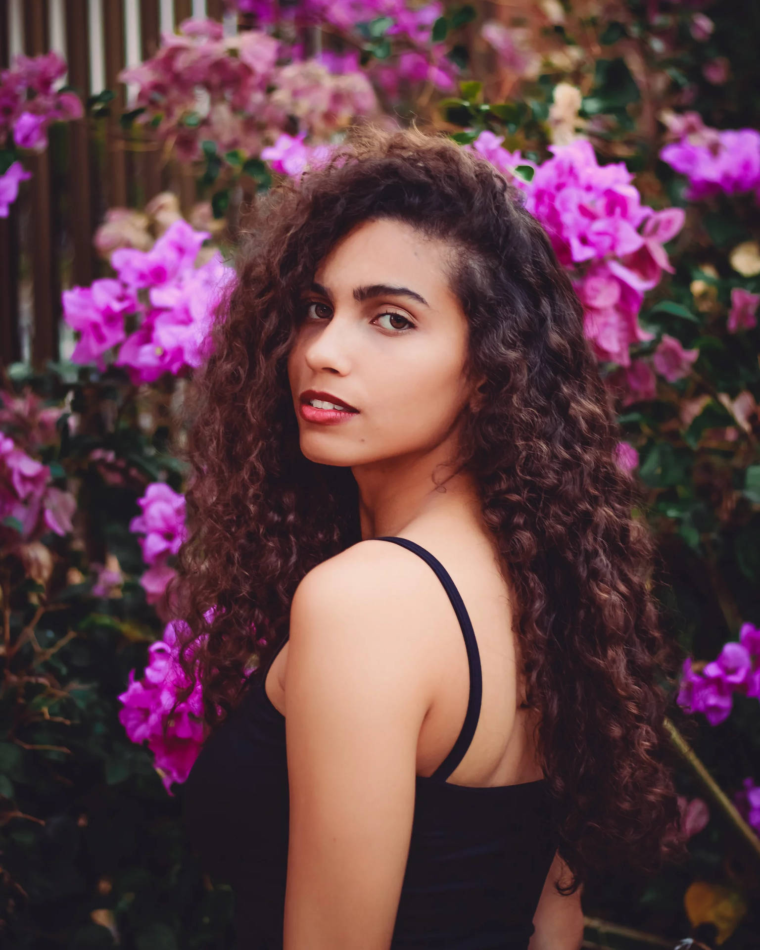 Latina Girl Among Flowers Background