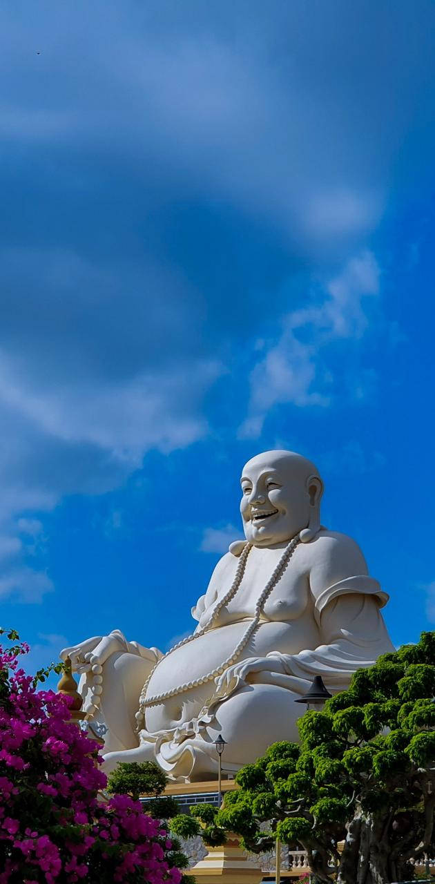 Laughing Buddha Statue In Chùa Phật Lớn Background