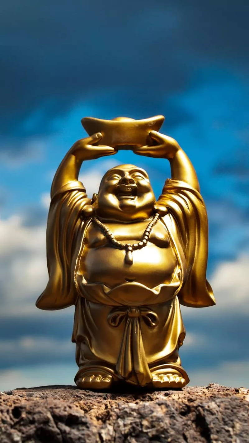 Laughing Buddha Under The Blue Sky Background