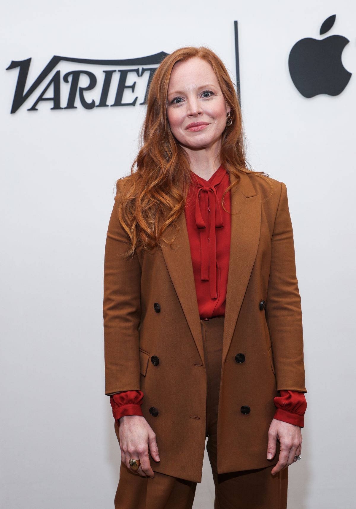 Lauren Ambrose In A Brown Suit Background