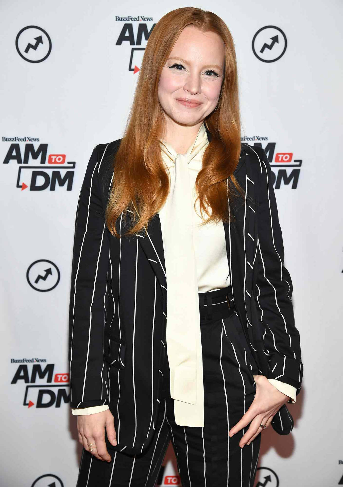 Lauren Ambrose In A Striped Suit Background