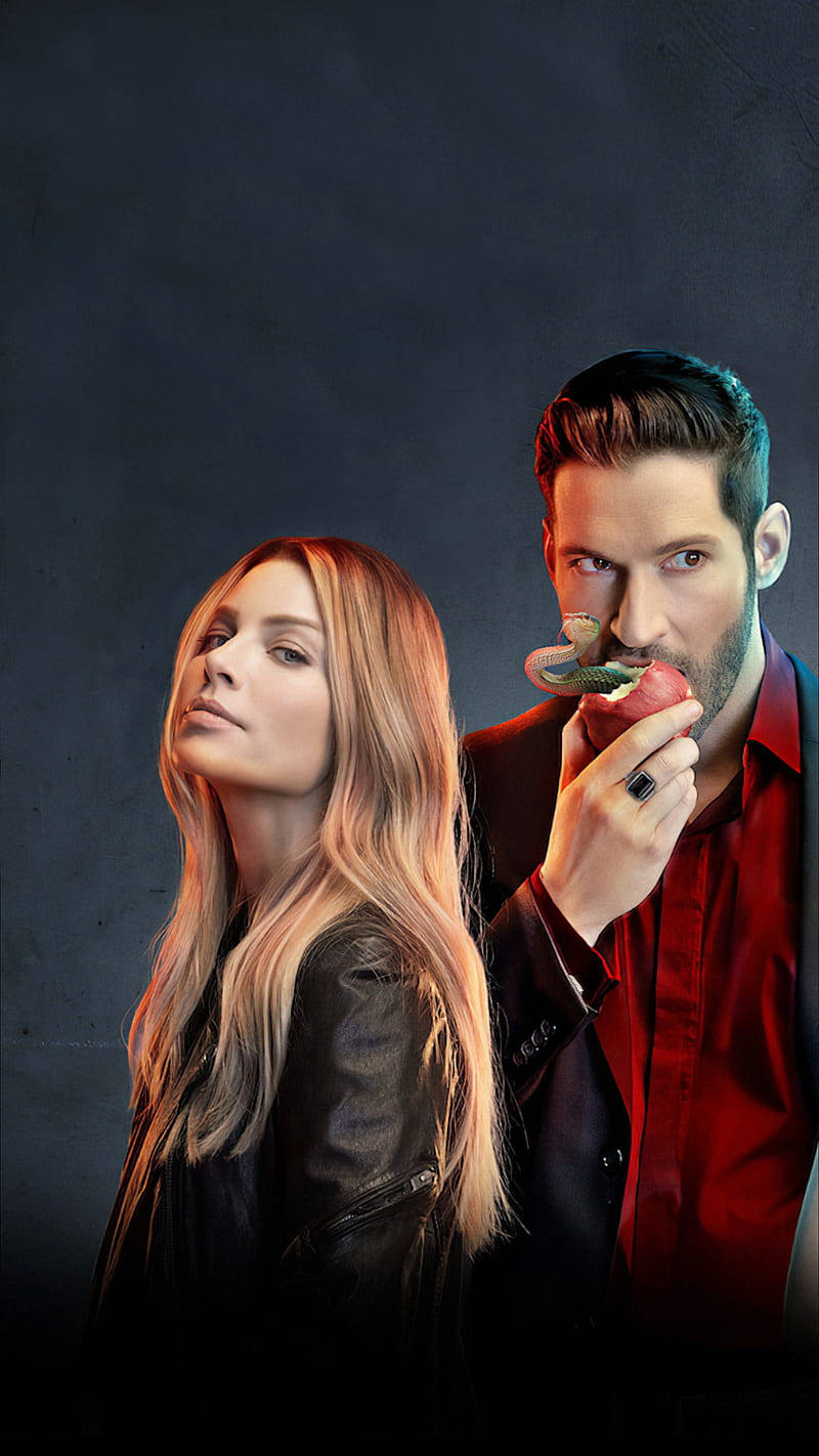 Lauren German Glancing With Tom Ellis Background