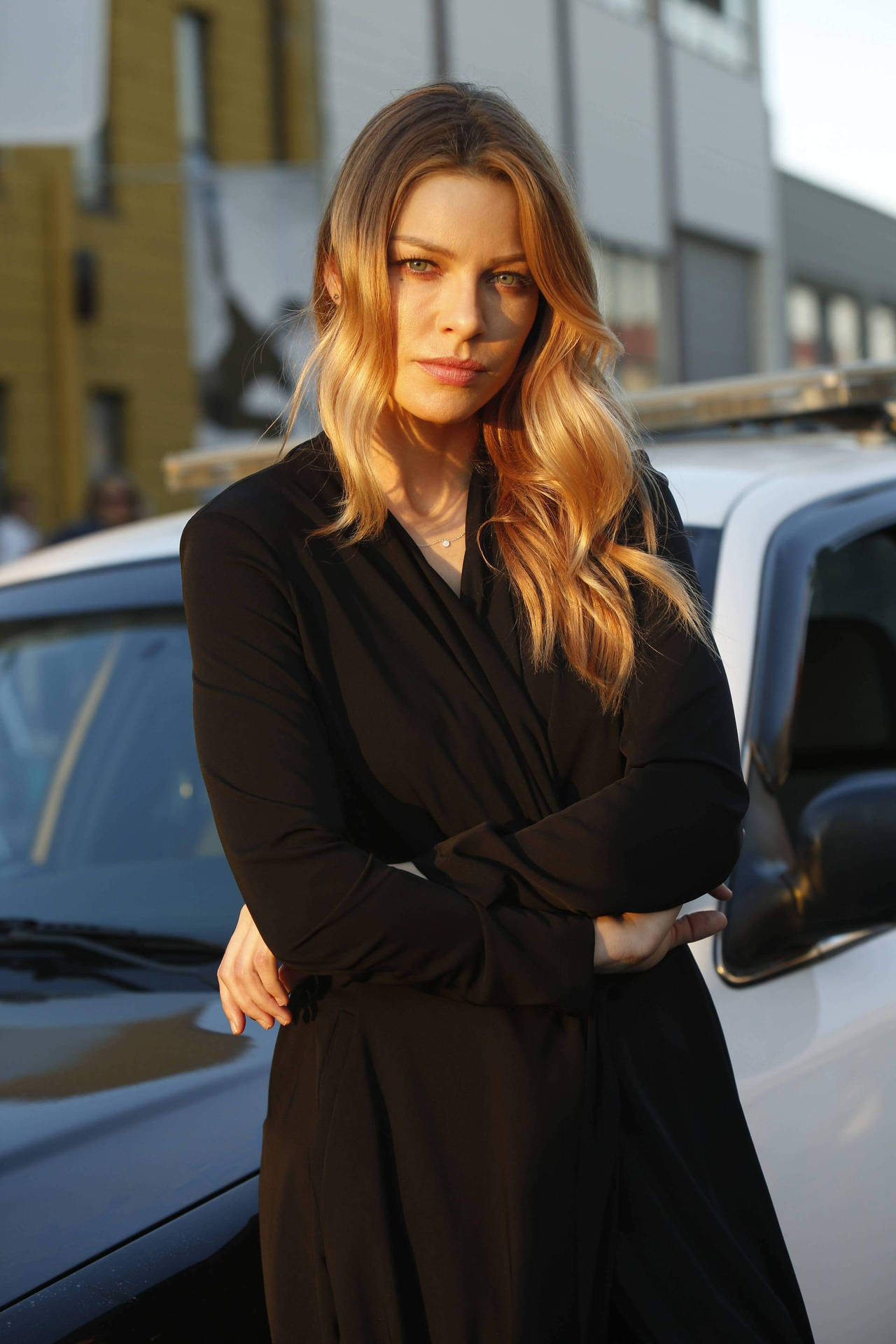 Lauren German Leaning On A Car Background