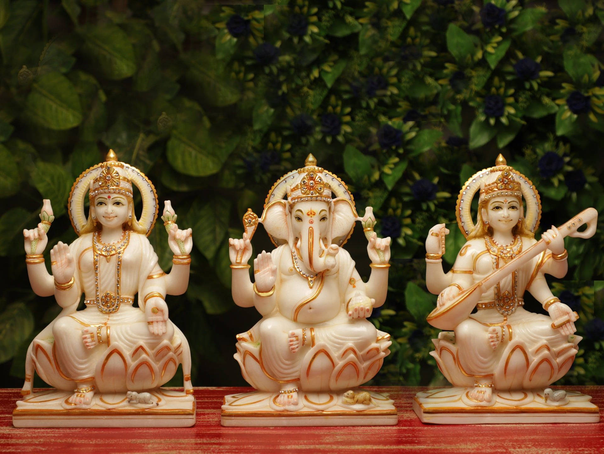 Laxmi Ganesh Saraswati White Figurines Background