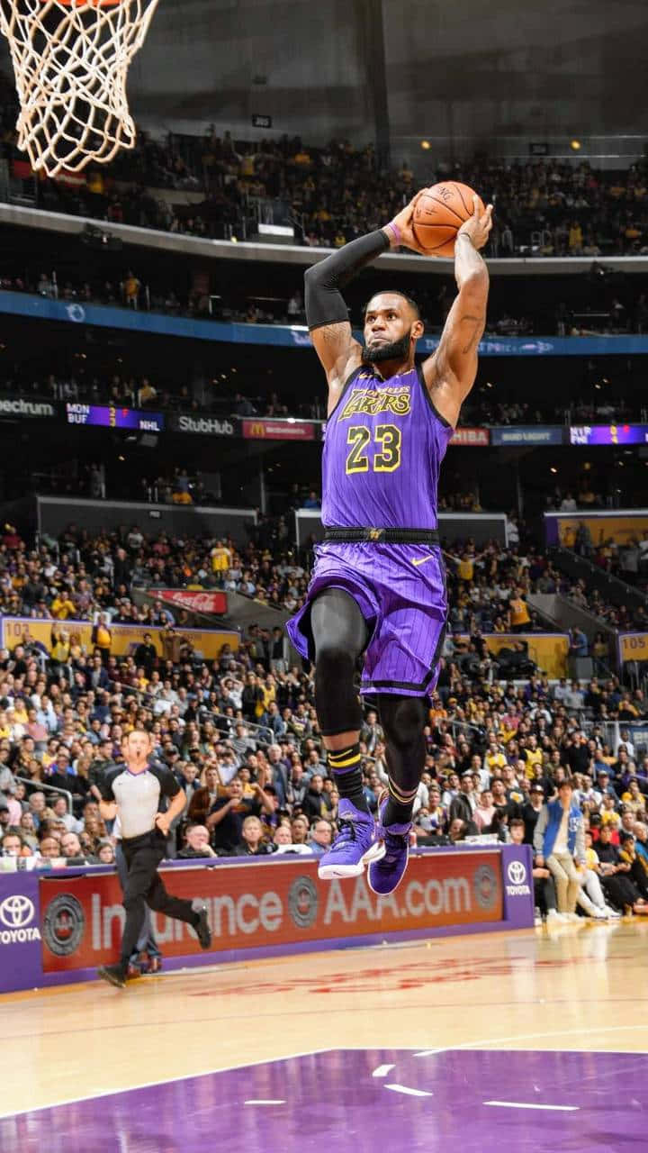 Le Bron_ James_ Soaring_ Dunk_ Lakers Background