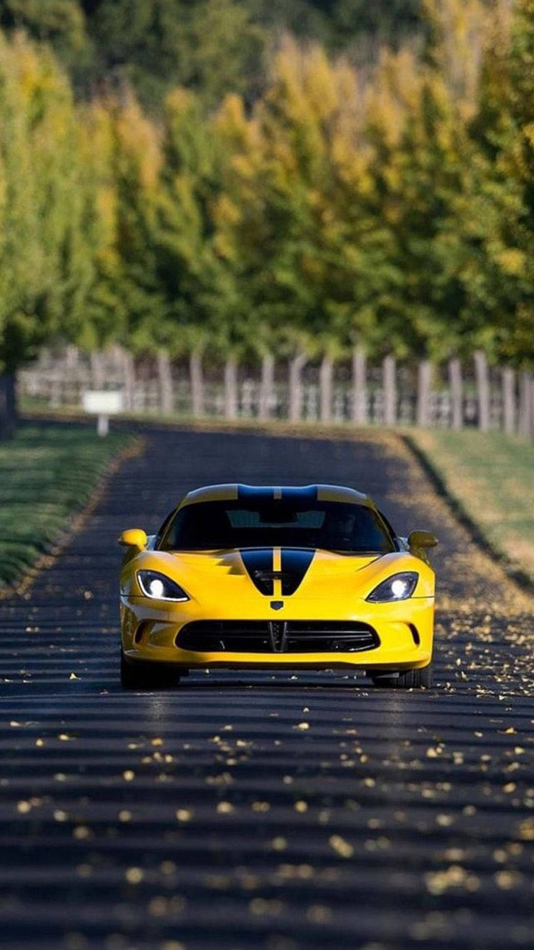 Leaves And Yellow Sports Car Iphone Background