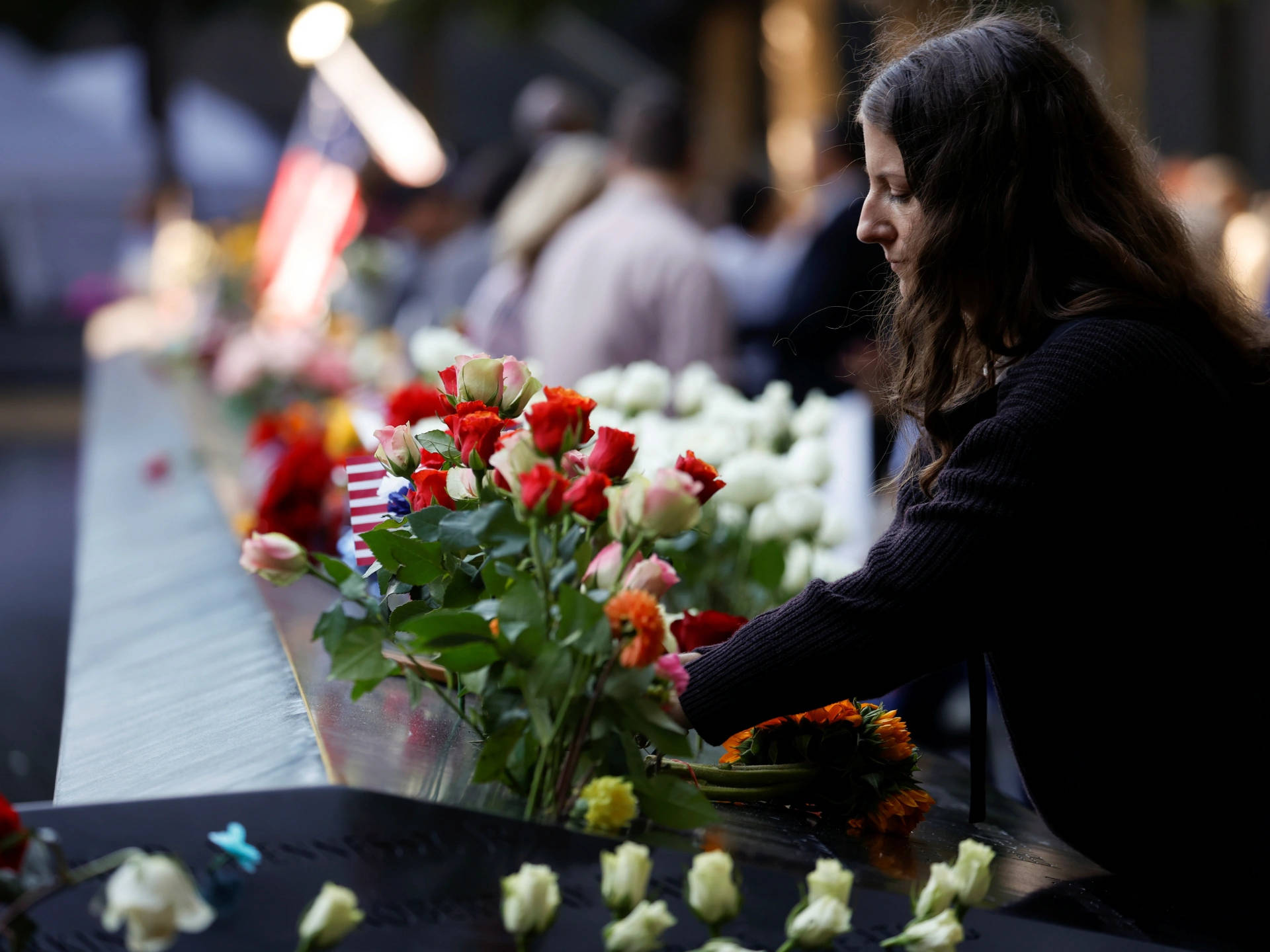 Leaving Flowers At 911 Memorial