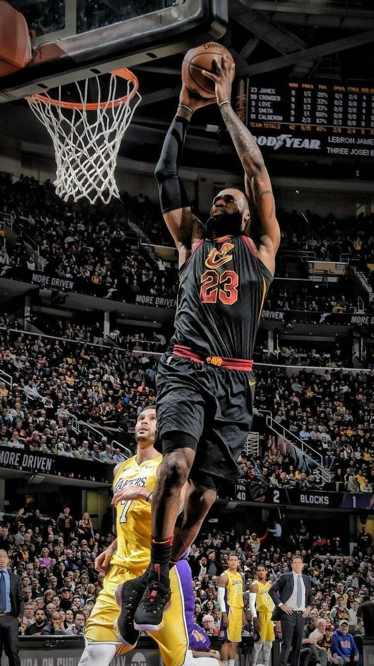 Lebron James In His Cavs Jersey Slam Dunking