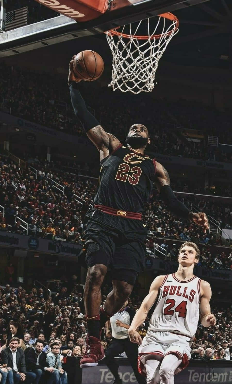 Lebron James Showcasing Skill On Iphone Wallpaper Background