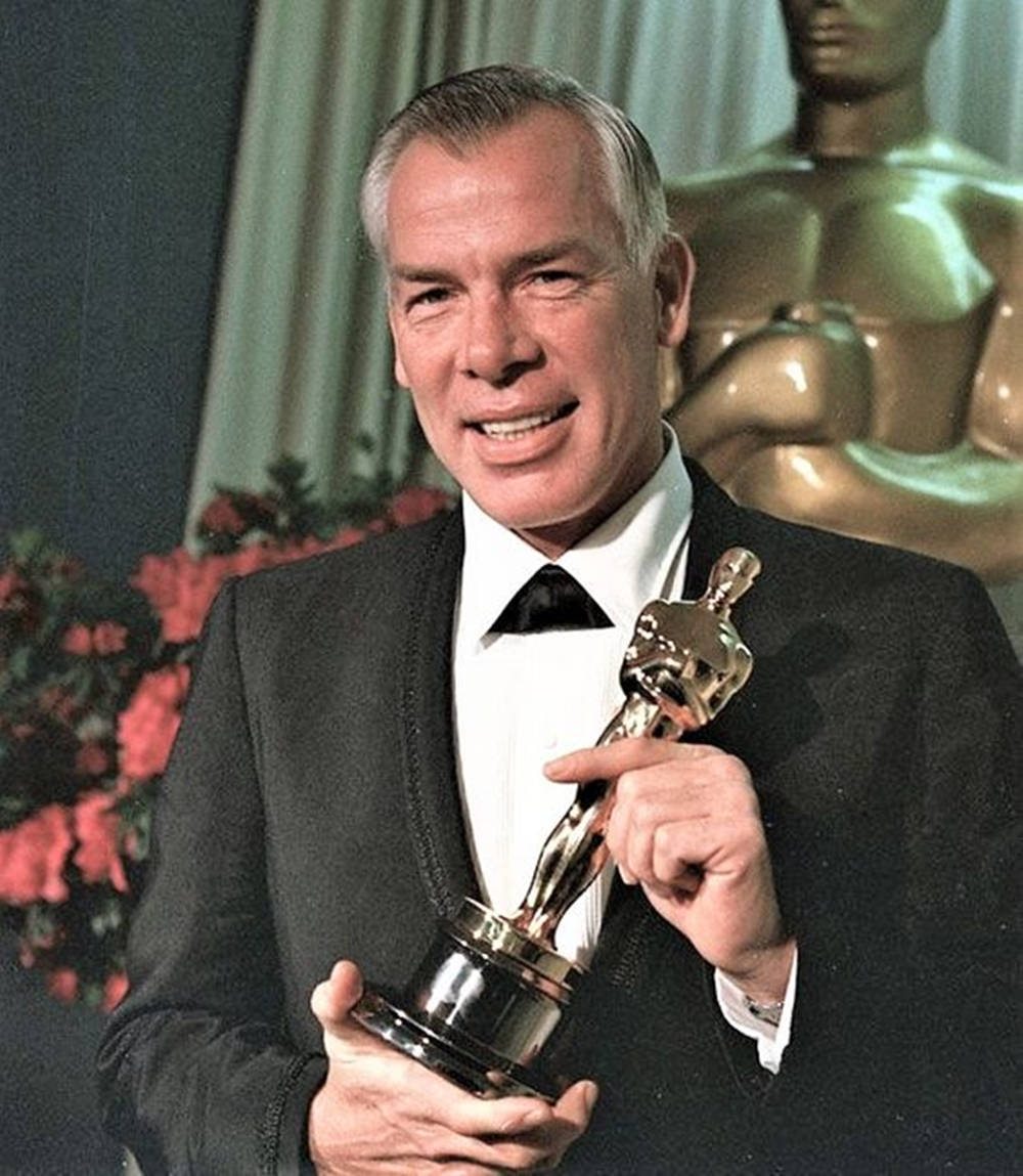 Lee Marvin Holding Trophy