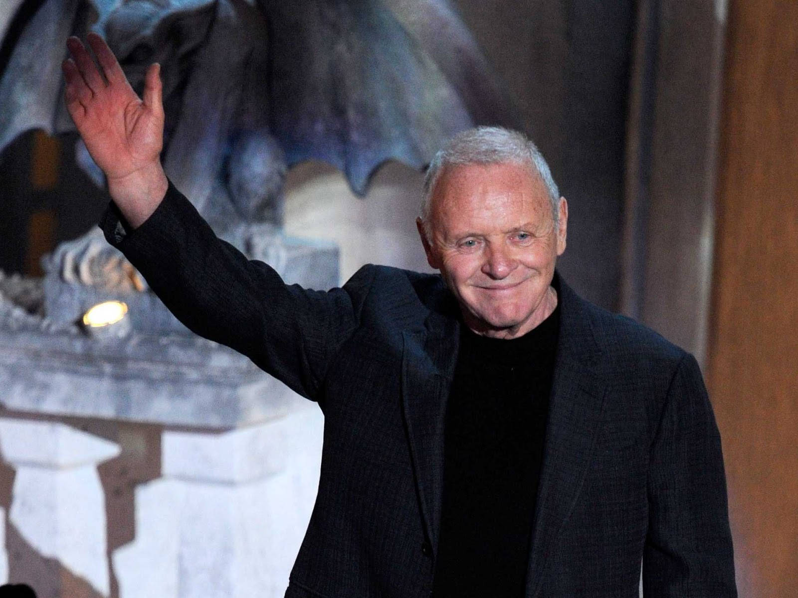 Legendary Actor Anthony Hopkins Joyfully Waving Background