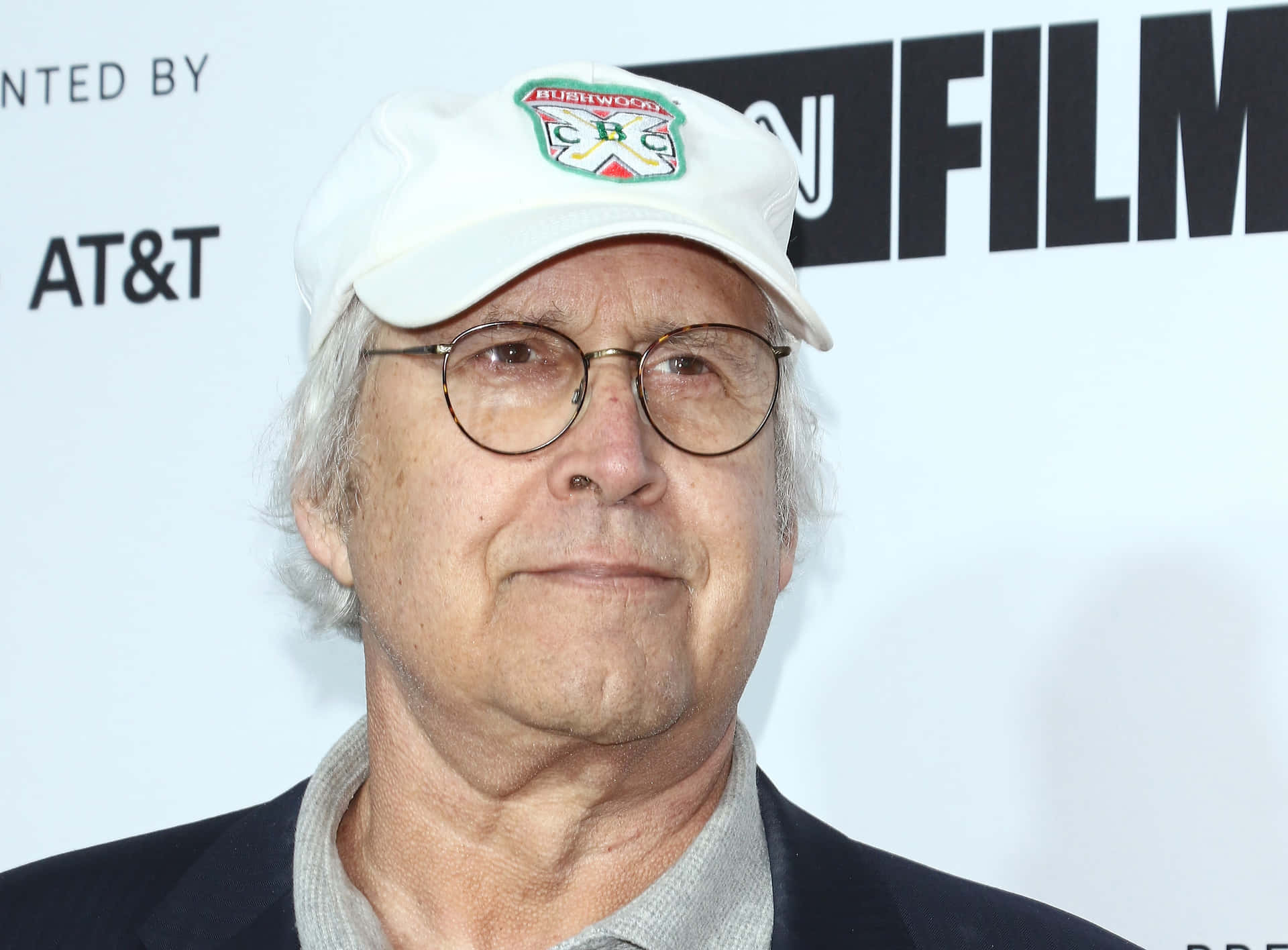Legendary Actor Chevy Chase In Classic Pose Background