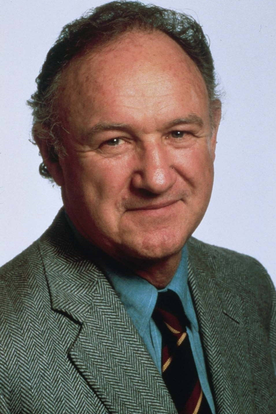 Legendary Actor Gene Hackman Posing For A Portrait Background