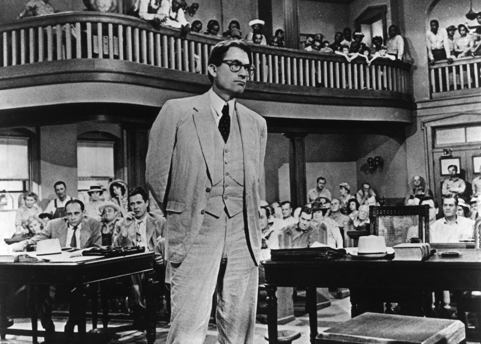 Legendary Actor Gregory Peck Standing In A Crowd Background